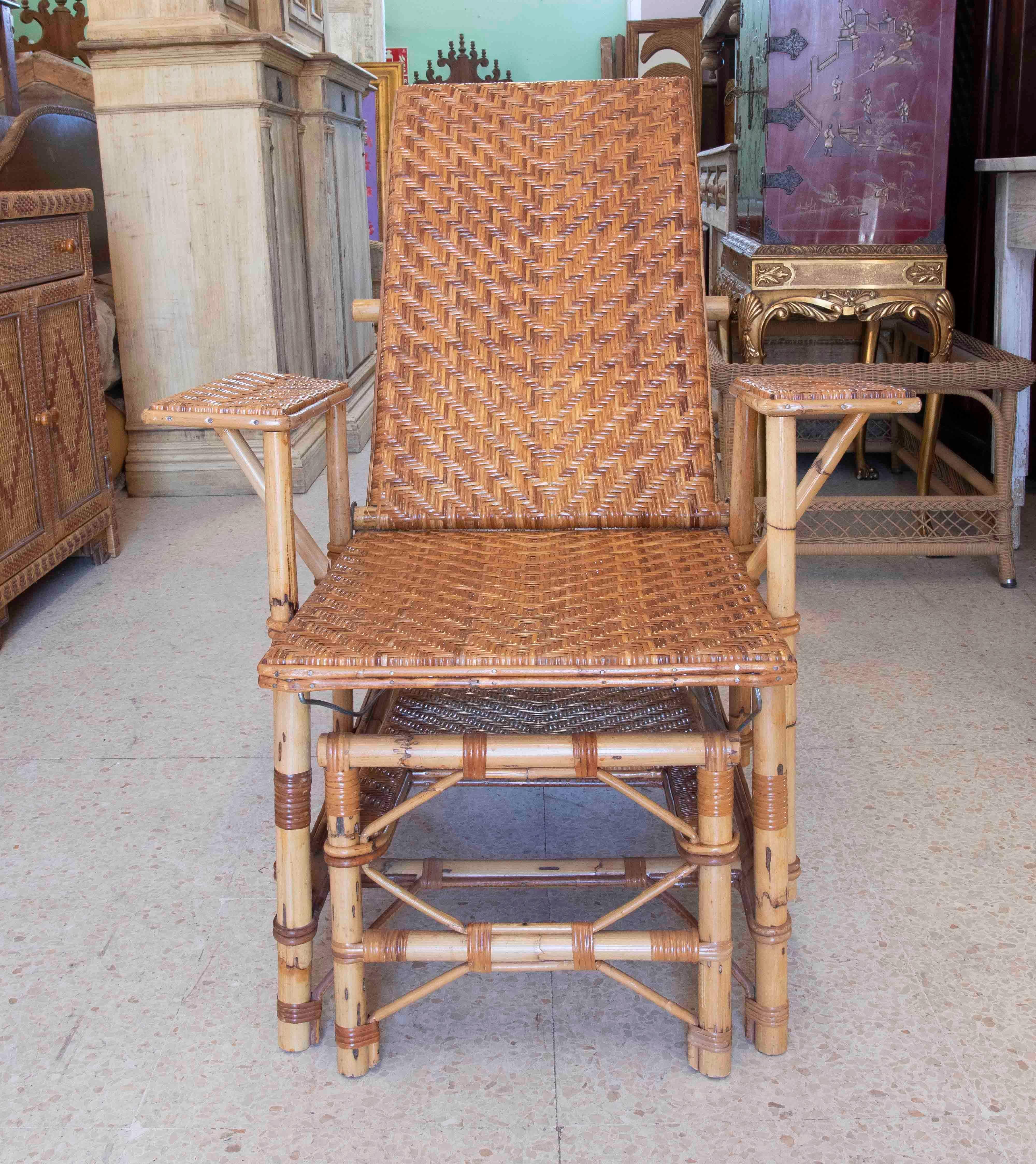 1970s Bamboo and Wicker Lounger Armchair with Footrest 
Measurements of the open armchair: 64x190x76cm