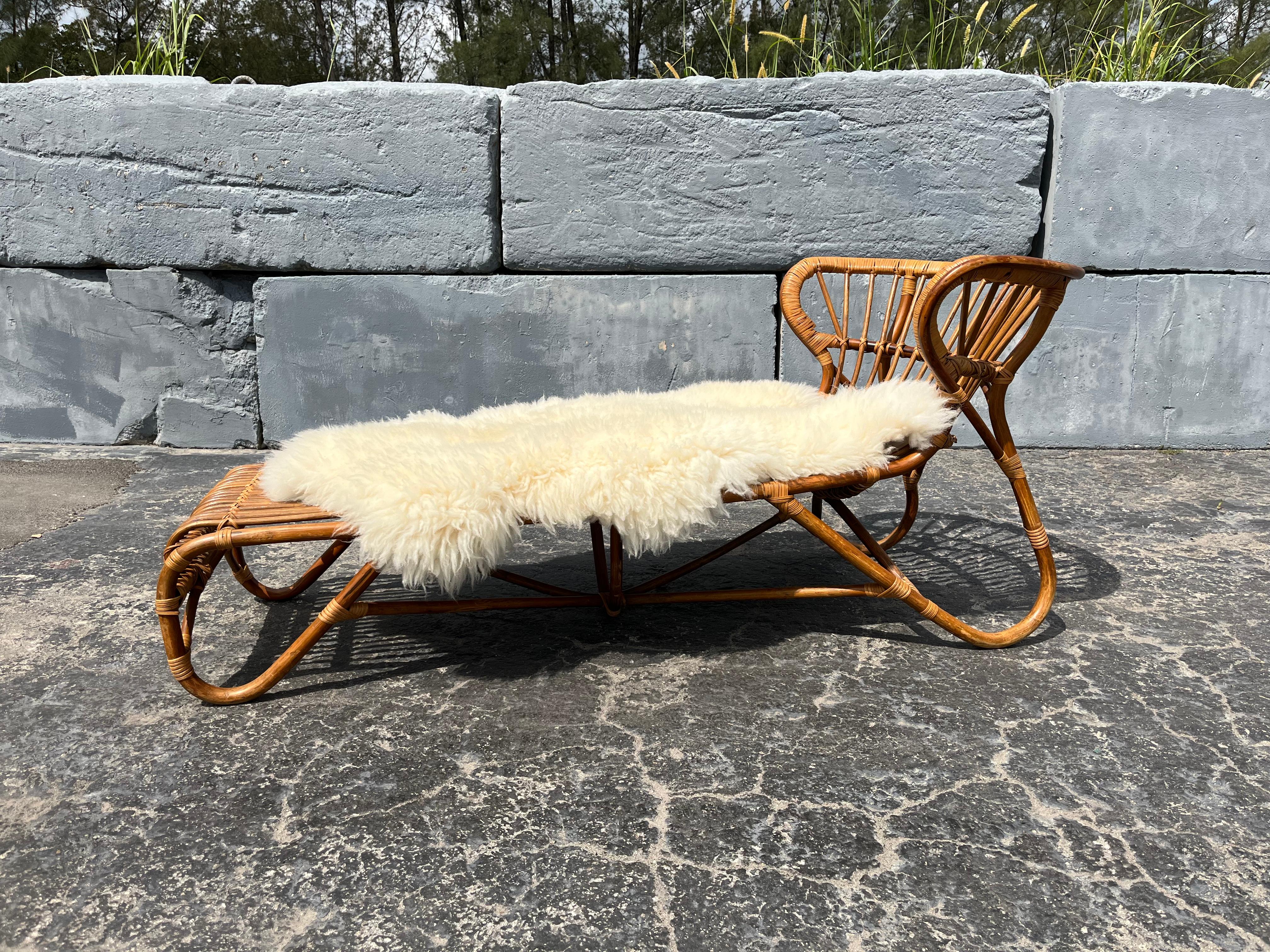 1970s Bamboo Chaise Lounge Attributed to Viggo Boesen.
Bamboo with cane wrap. Ready for a new home. 
Sheepskin is included, sheepskin has some natural oder.