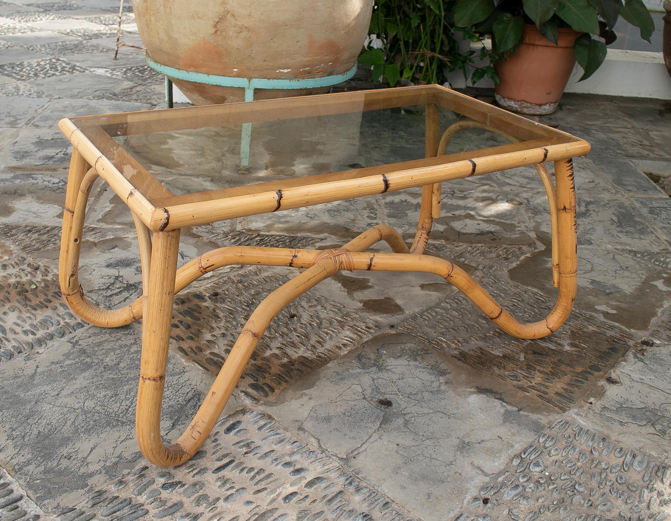 1970's Spanish bamboo coffee table with crsital.
