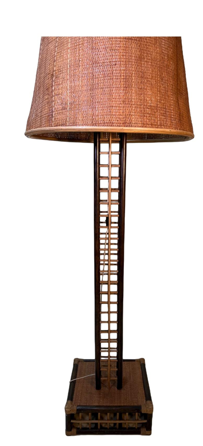 1970's Bamboo Floor Lamp.
Bamboo floor lamp dark brown and beige. Light brown shade. 