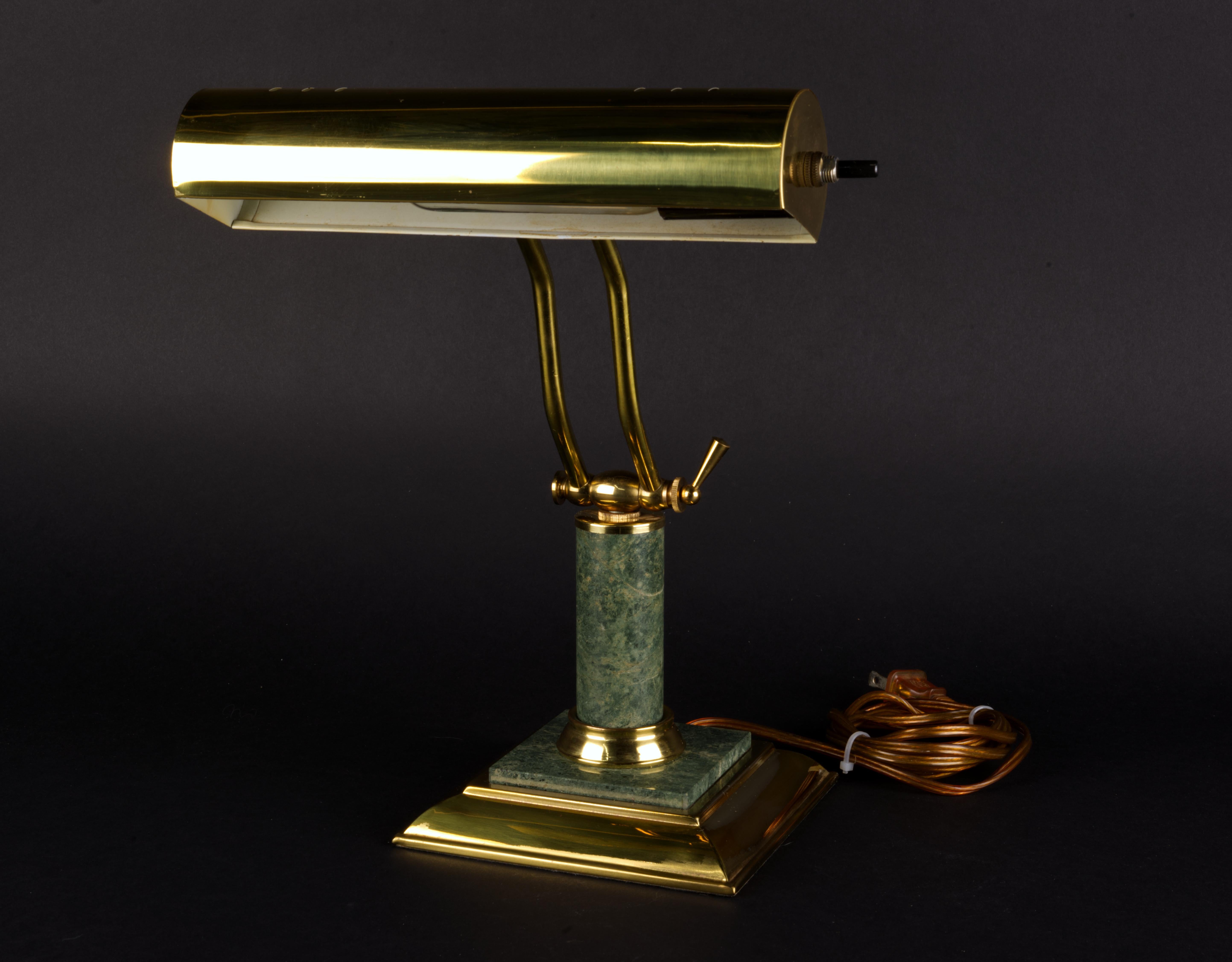 Art Deco revival Bankers Lamp in green marble and brass. 
Brass has a nice patina. Marble is in great condition. The lamp is fully functional. 
This type of the lamp can be used in variety of situations, such as desk, book shelves, piano light, or