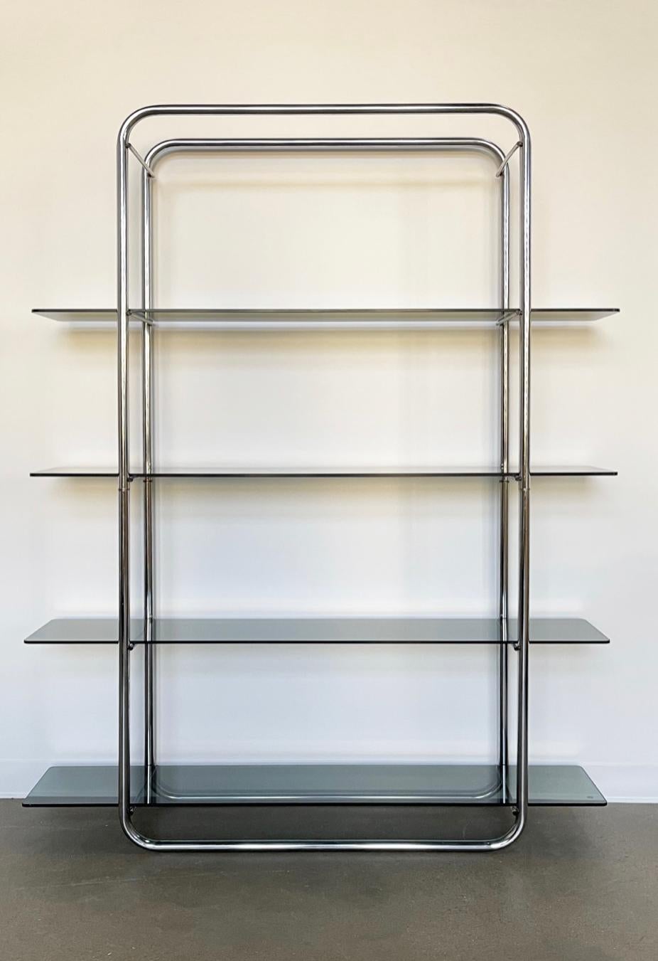 Classic Bauhaus tubular chrome and smoked glass shelving. New glass. Excellent vintage condition. 1970's.