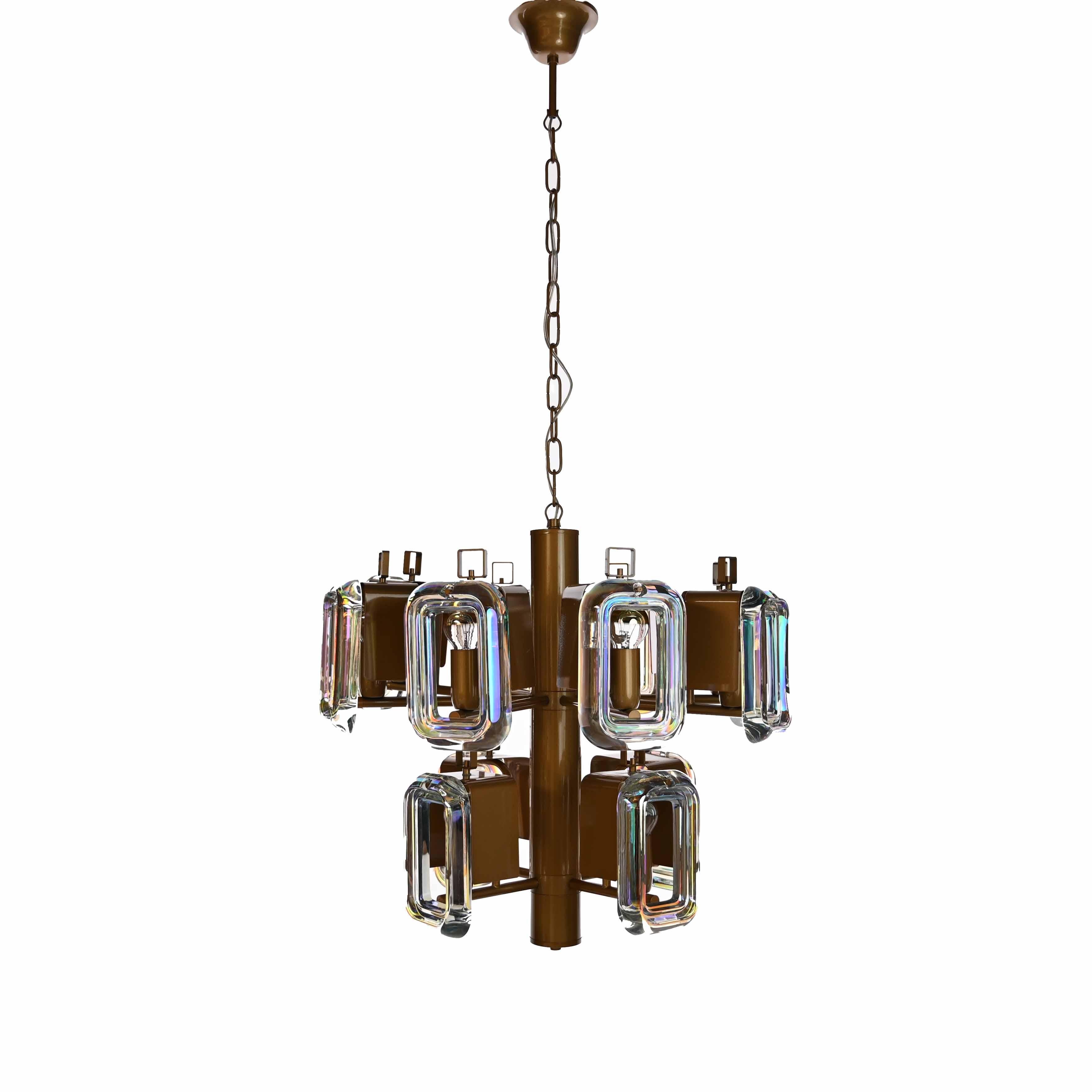 Sleek robust chandelier from 1970s with a coated frame and beautiful thick iridescent square glass pieces. Two tiers with twelve square glass plates attached and twelve E14 lightbulbs.
Measures: Height with chain 104 cm, height without chain 50cm,
