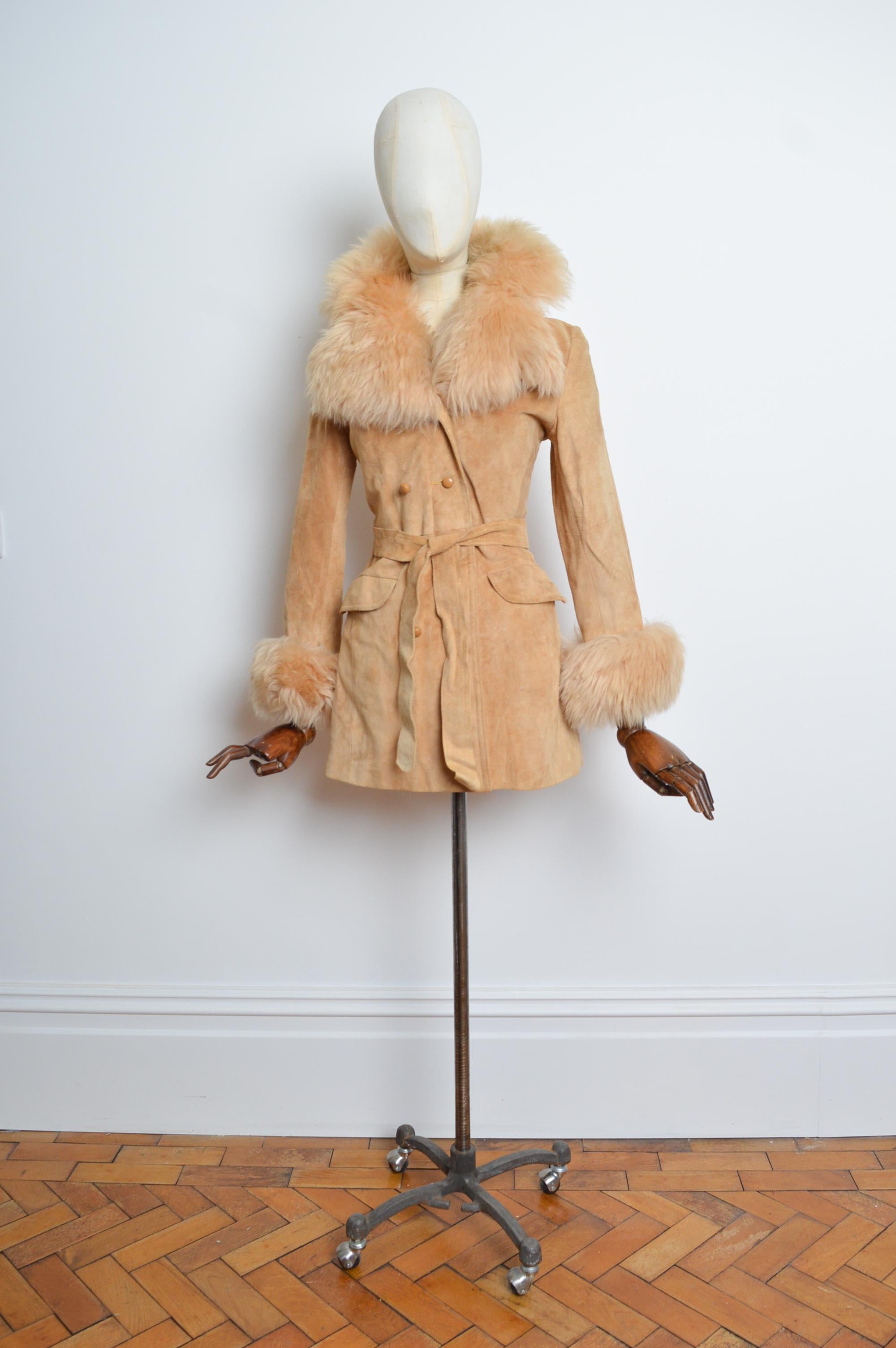Superb 1970’s statement suede coat with huge fluffy collar and cuff details, featuring double breasted button closure, hip pockets and complete with the original waist belt. 
Size; UK 6 - 8 (XS-Small)
Measurements are provided in inches (‘’)
Pit to