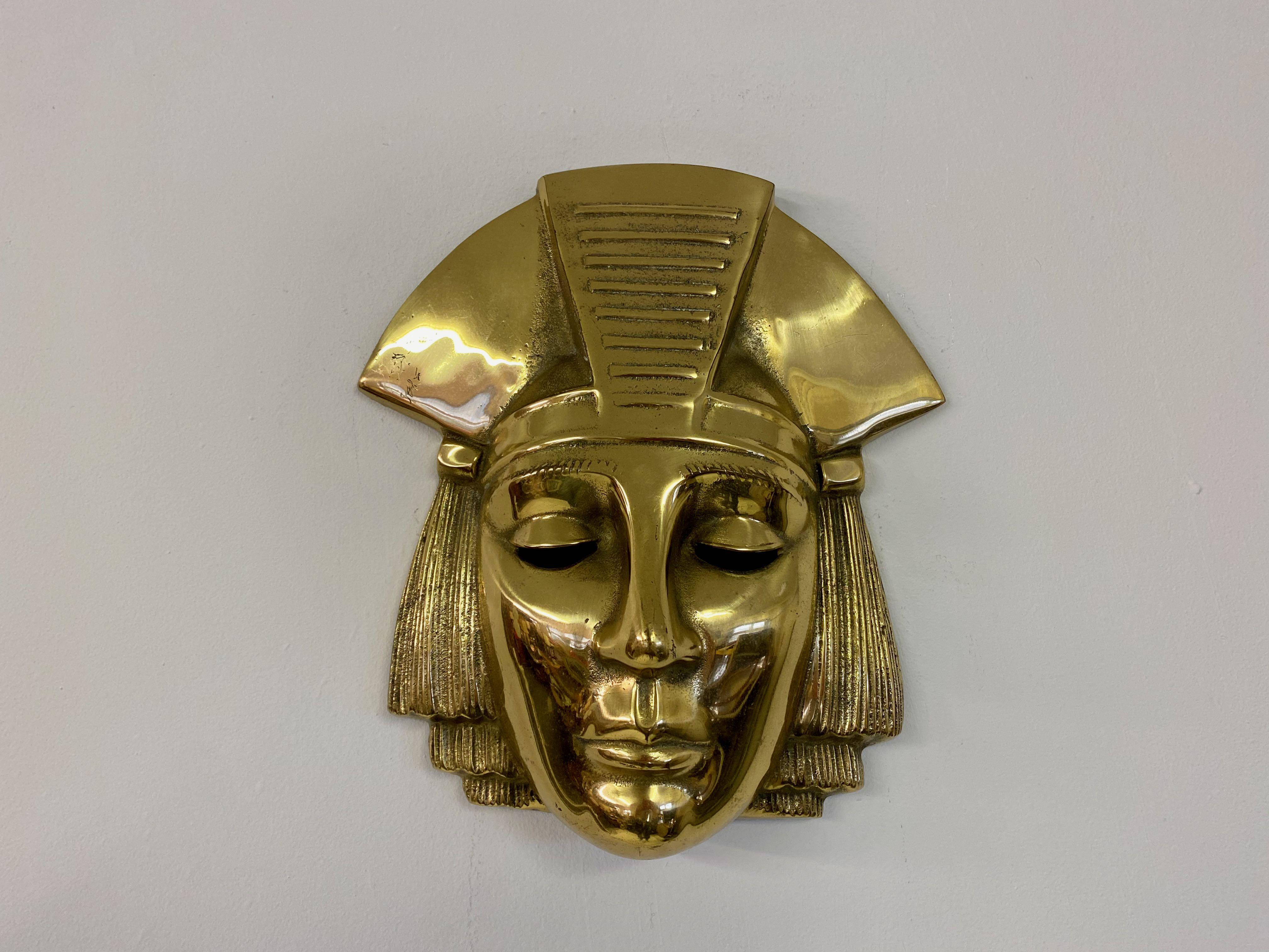 Brass Pharaoh face

Hanging plaque

Belgian 1970s.