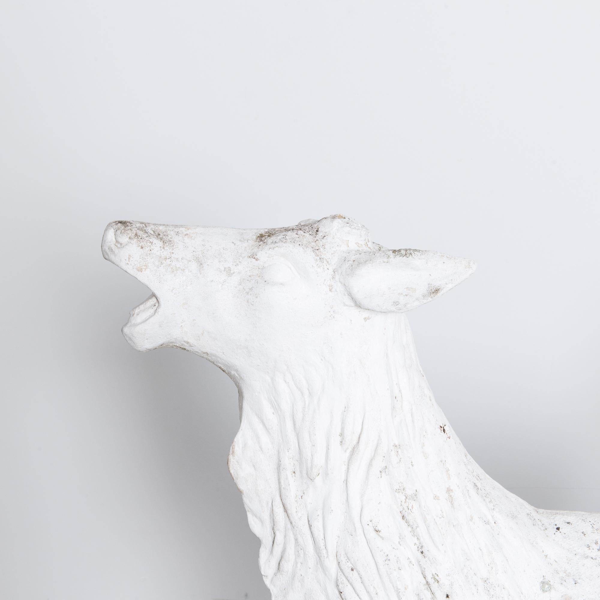 Introducing a striking piece from the 1970s, the Belgian Concrete Deer stands resolute, embodying a powerful and evocative expression. This majestic creature, captured in a moment of dynamic intensity, emanates a visceral presence with its spirited