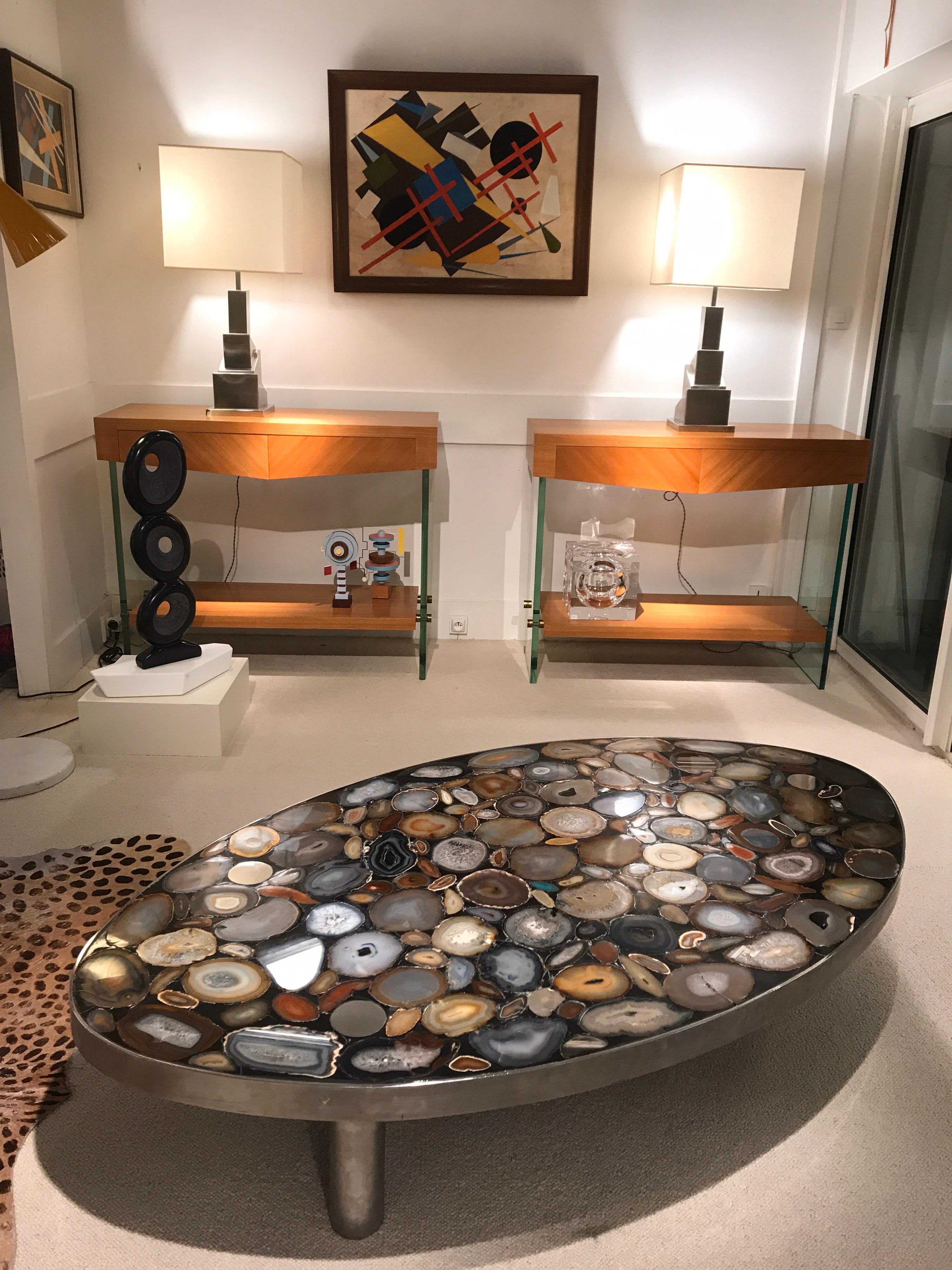 1970s coffee table with different kind of Agates inlay fixed with black resin.
The table has 3 massive stainless steel feets 
Great quality.
