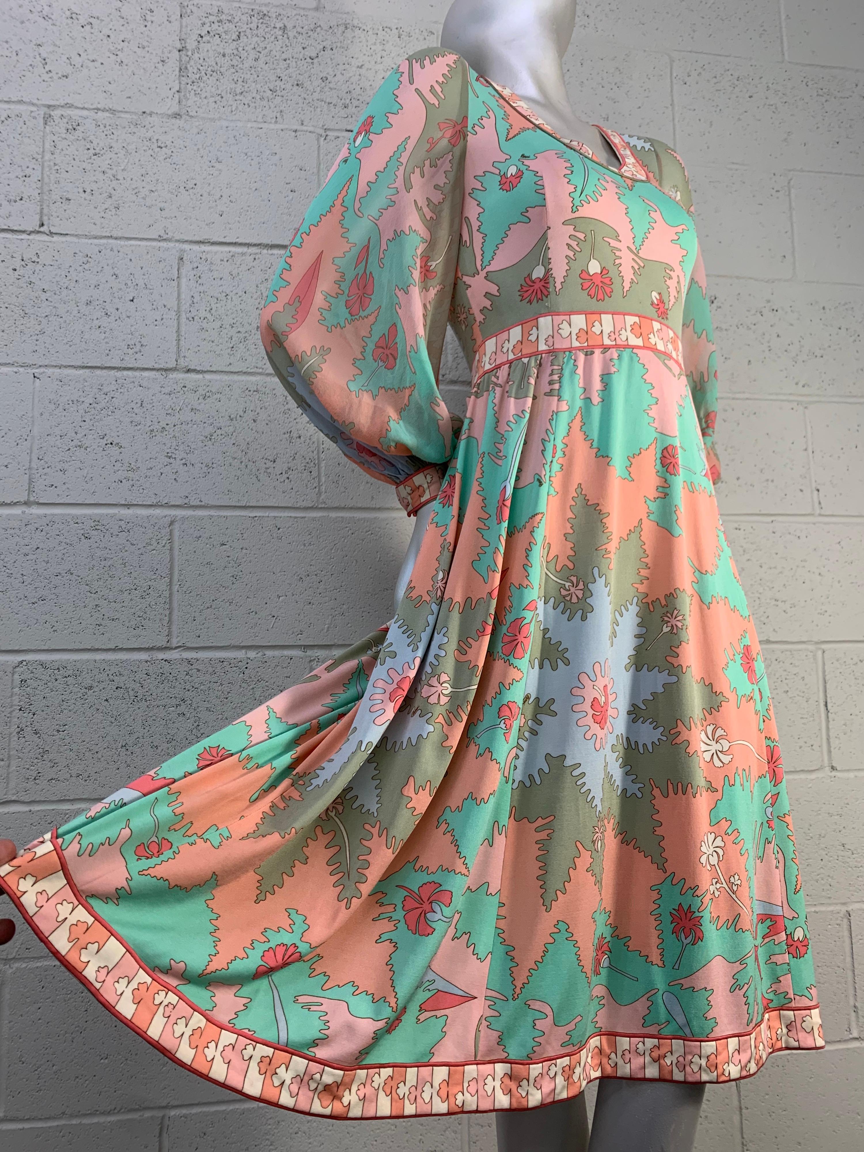 A stunning early 1970s Bessi silk jersey classic Pucci-esque print dress with chiffon balloon sleeves in shades of peach, aqua persimmon and gray. Banded waist and full skirt for a graceful silhouette. Size 4. 