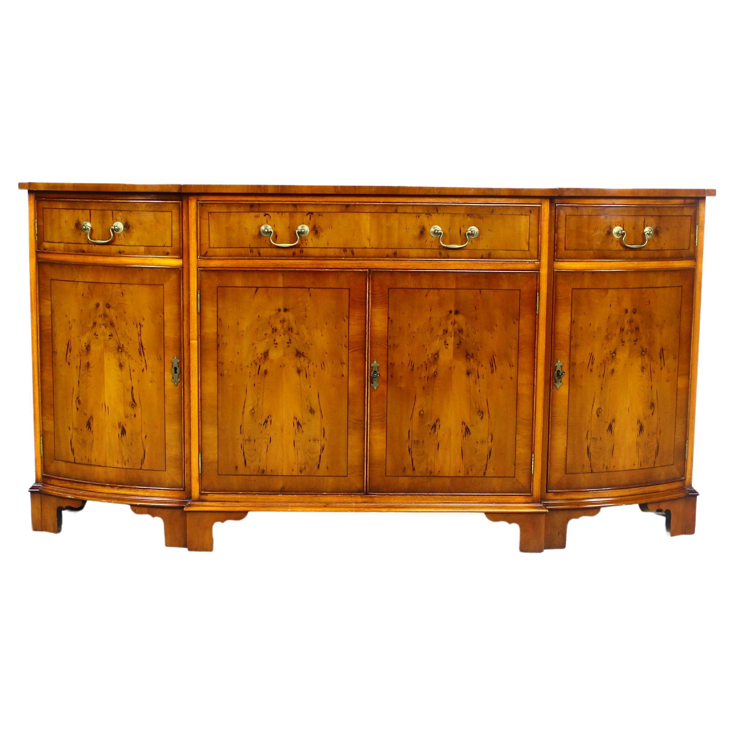 A VERY ATTRACTIVE, LATE 20th CENTURY, YEW-WOOD, INLAID AND CROSS-BANDED, BREAKFRONT SIDEBOARD, OF EXCEPTIONAL QUALITY AND CONDITION.

THIS FABULOUS SIDEBOARD IS ENGLISH MADE BY ONE OF THE LEADING FURNITURE MANUFACTURERS IN TODAYS MARKET PLACE, THE