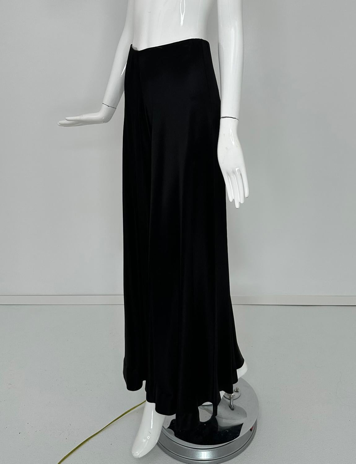 1970s bias cut, black crepe back satin, wide leg palazzo pant, with high seamed waist and slim hip, vintage 9-10. Beautiful weighty fabric with good drape.  Closes at the back with a zipper & hook & eye.  Very large leg hem opening.  In good pre