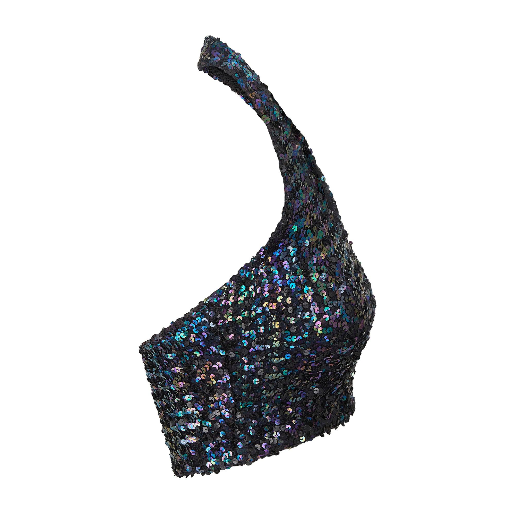 This early and collectable 1970s Biba sequin top is presented in superb vintage condition. This halter-neck top is tight fitting with a stretch finish allowing for a flexible fit. Sequins are sewn directly onto a stretch cloth created from weaving