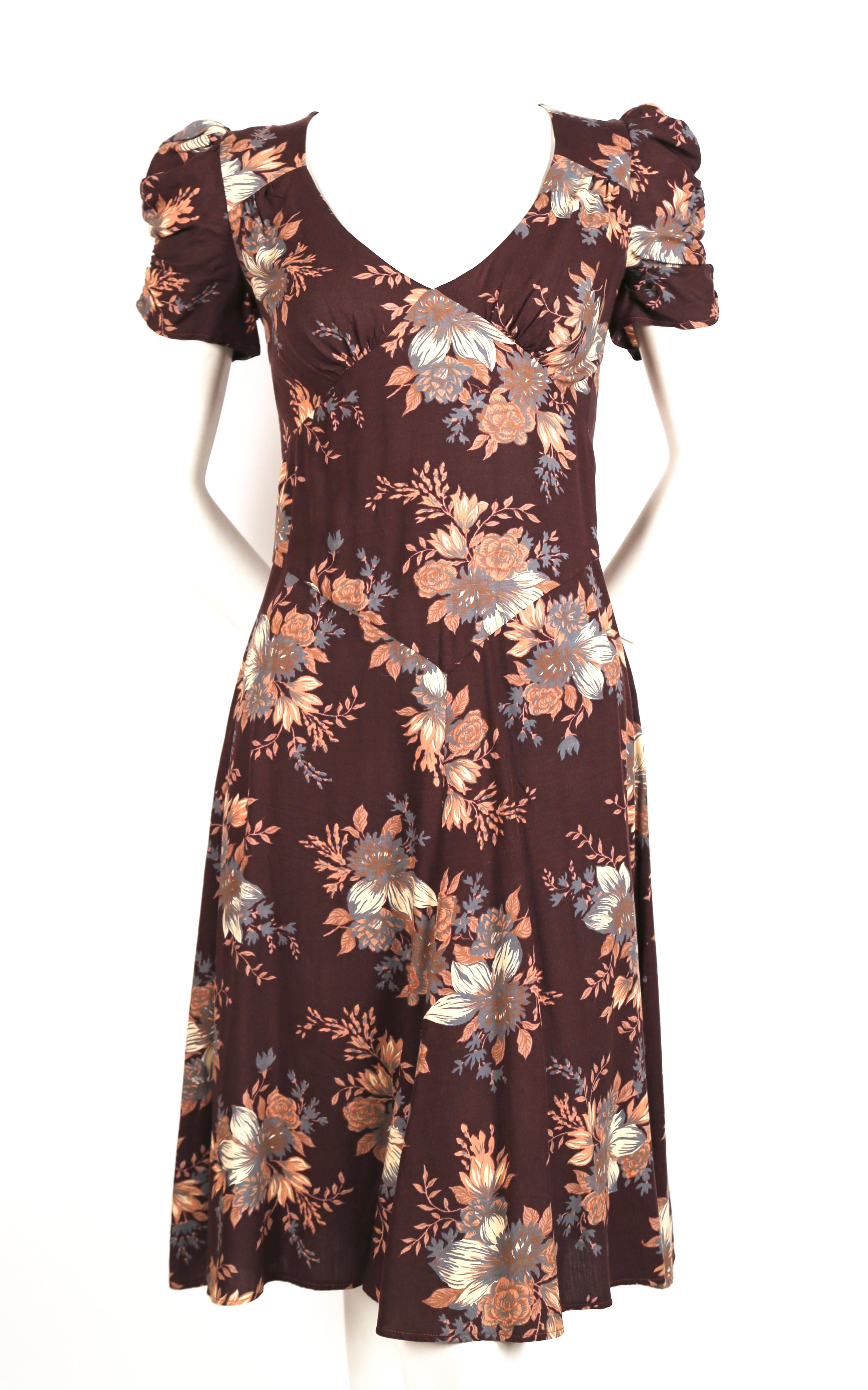 Beautiful brown floral dress with ruched puff sleeves designed by Barbara Hulanicki for Biba dating to the 1970's. No size is indicated however this would best fit a US 4 or 6. Approximate measurements: shoulder 14.5