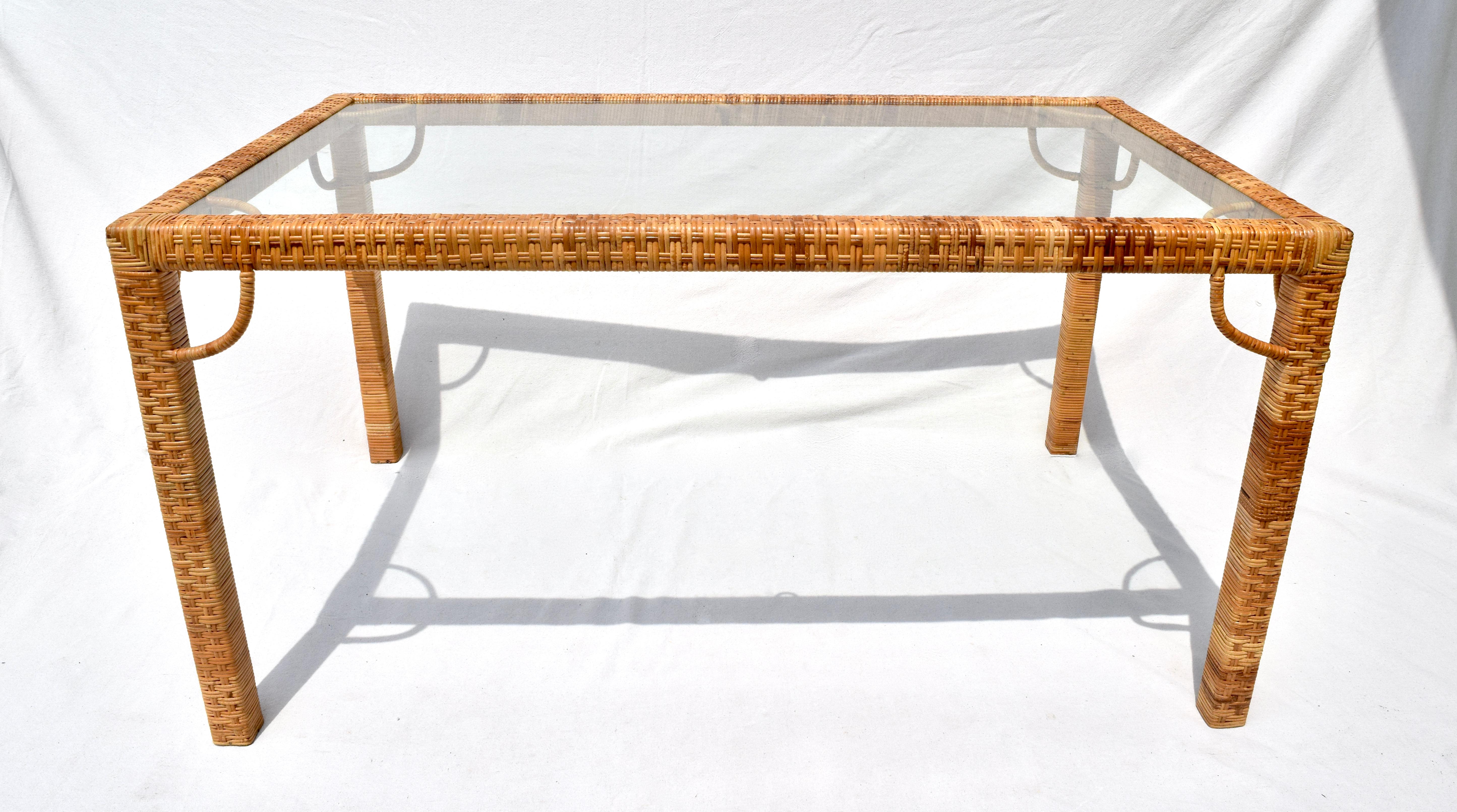 1970's Bielecky Brothers rattan & glass Parsons dining or writing table of substantial Raffia & wood construction with original removable glass top insert. Beautifully maintained over the years in rarely used condition. Nicely compliments our set of