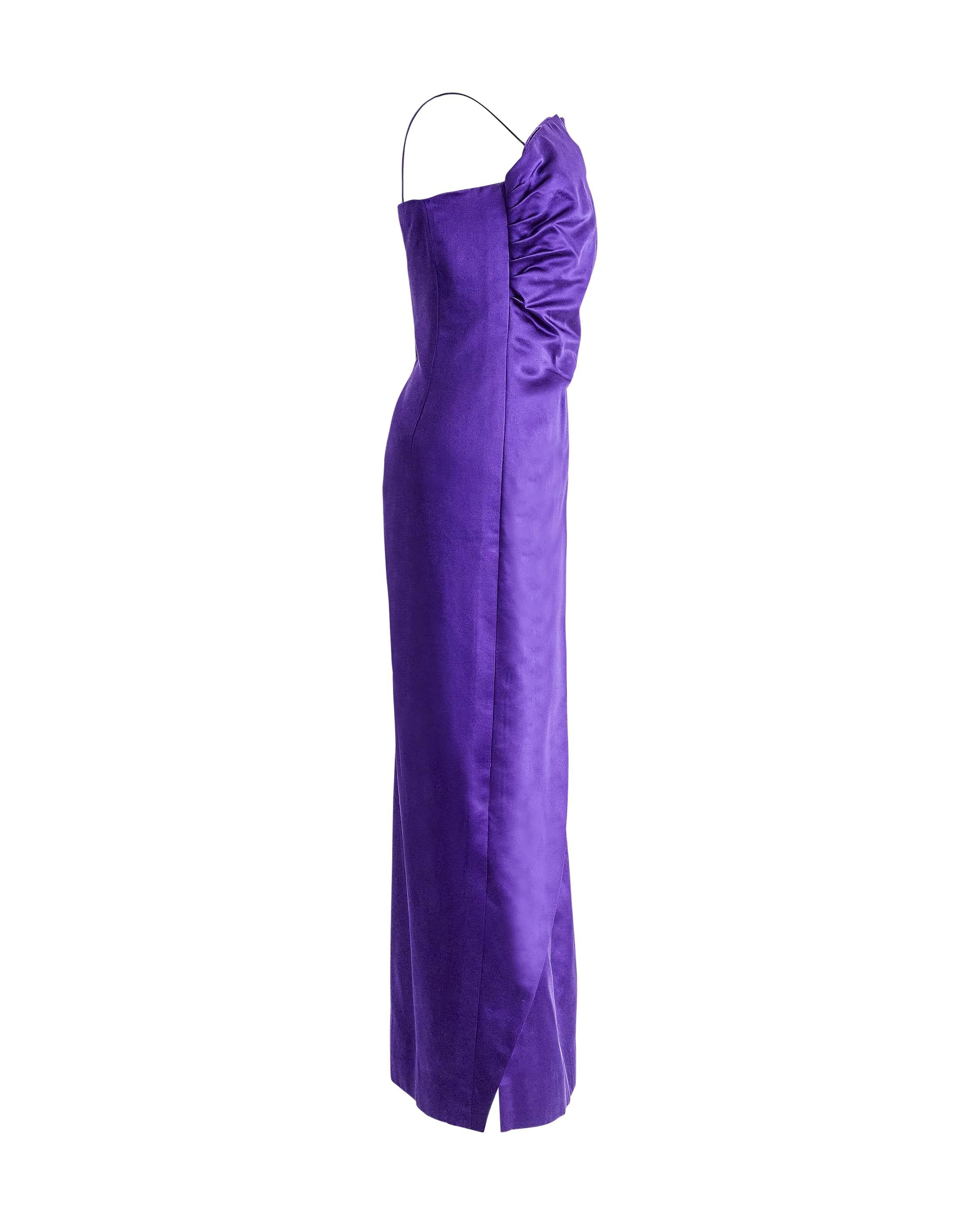 1970's Bill Blass purple silk satin asymmetrical gown. One-shoulder column gown with side zip closure and single spaghetti strap. Ruching at side creates beautiful drapery across the body. 