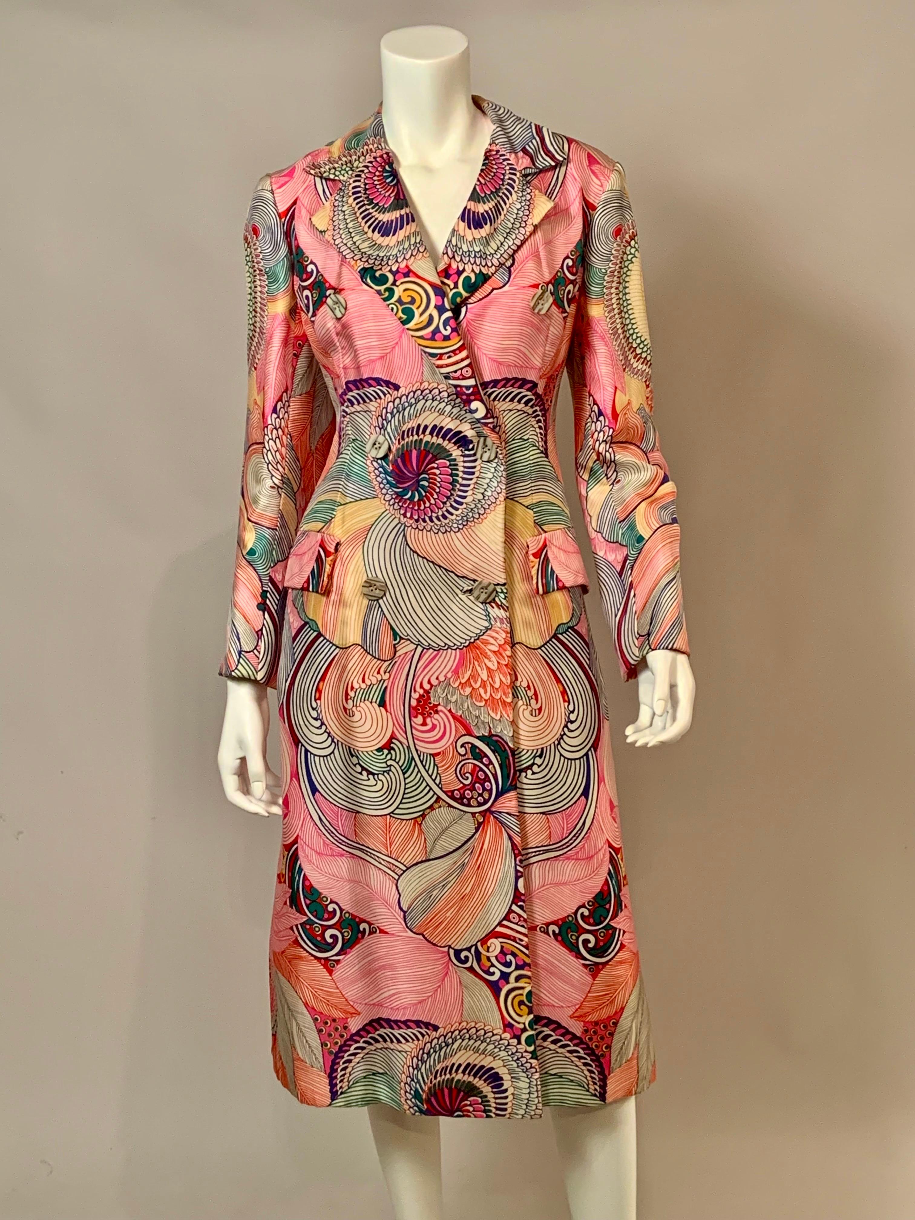 This 1970's silk coat from Bill Blass  is just stunning.  The colorful print is so evocative of the decade.  Large scale flowers are in shades of pink, orange, green, yellow, hot pink, and navy blue.  The fabric is so nice that Bill Blass lined the