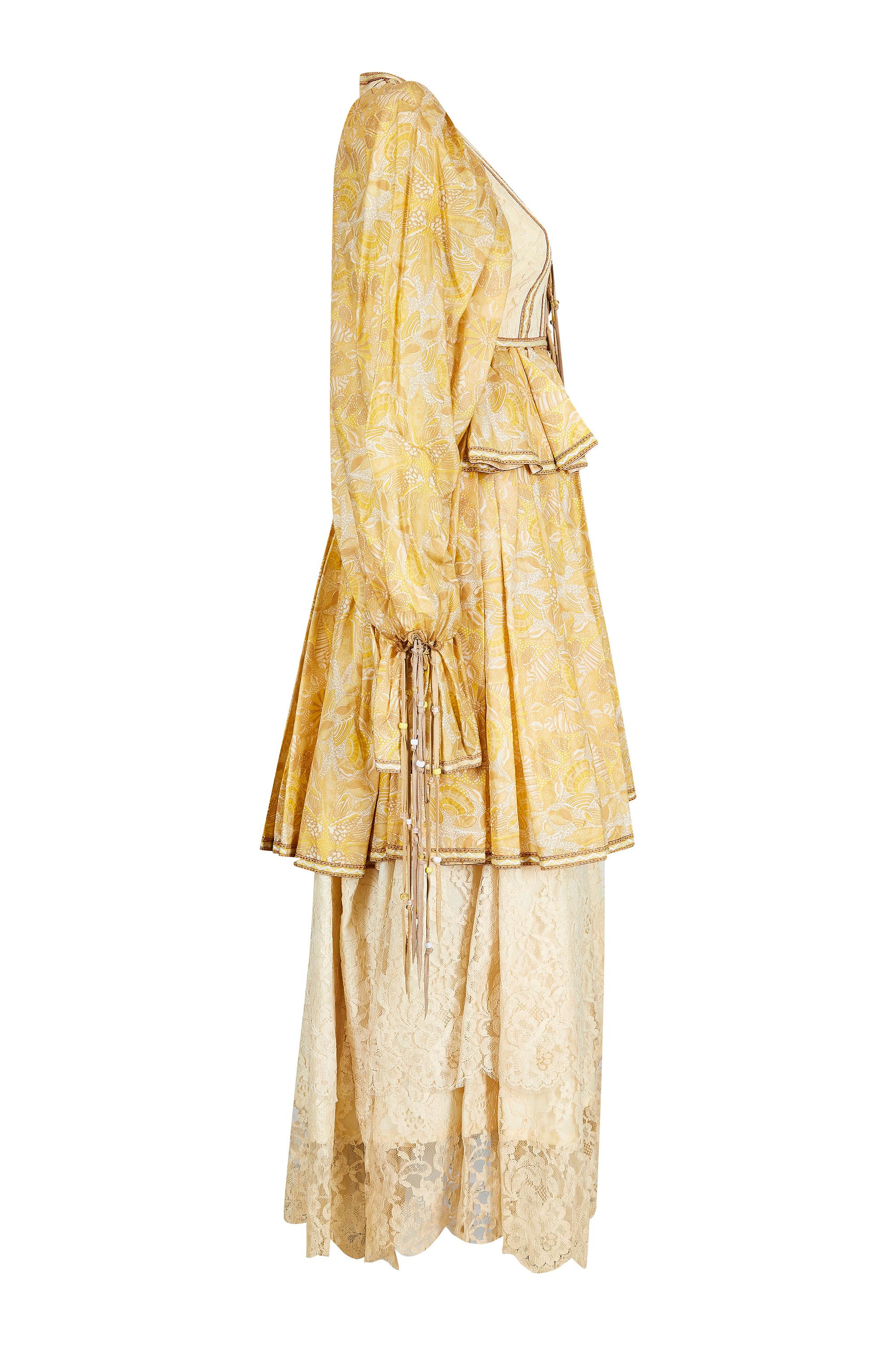 This incredible 1970s peasant style dress with layered skirt and tassel detail is by British designer Bill Gibb, who's work is described as the nearest a British designer ever got to haute couture. This exceptional piece is a wonderful example of
