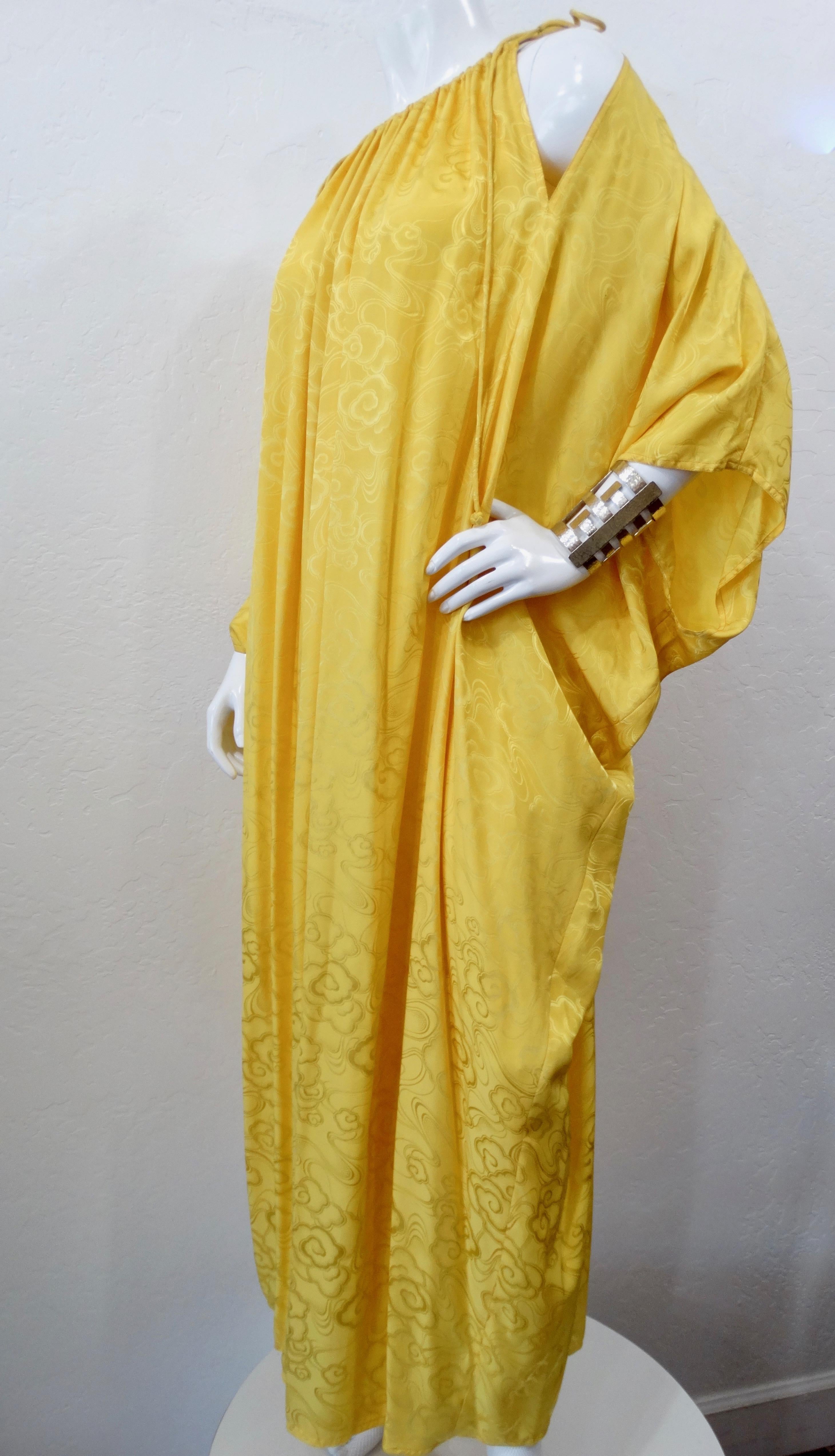 Walk like a ray of vintage sunshine with this beautiful Bill Tice for Malcom Starr for Lord & Taylor kaftan! Circa 1970s, this kaftan is made of bright yellow gold Silk and features a gorgeous Chinese inspired abstract motif. Includes a cinched high