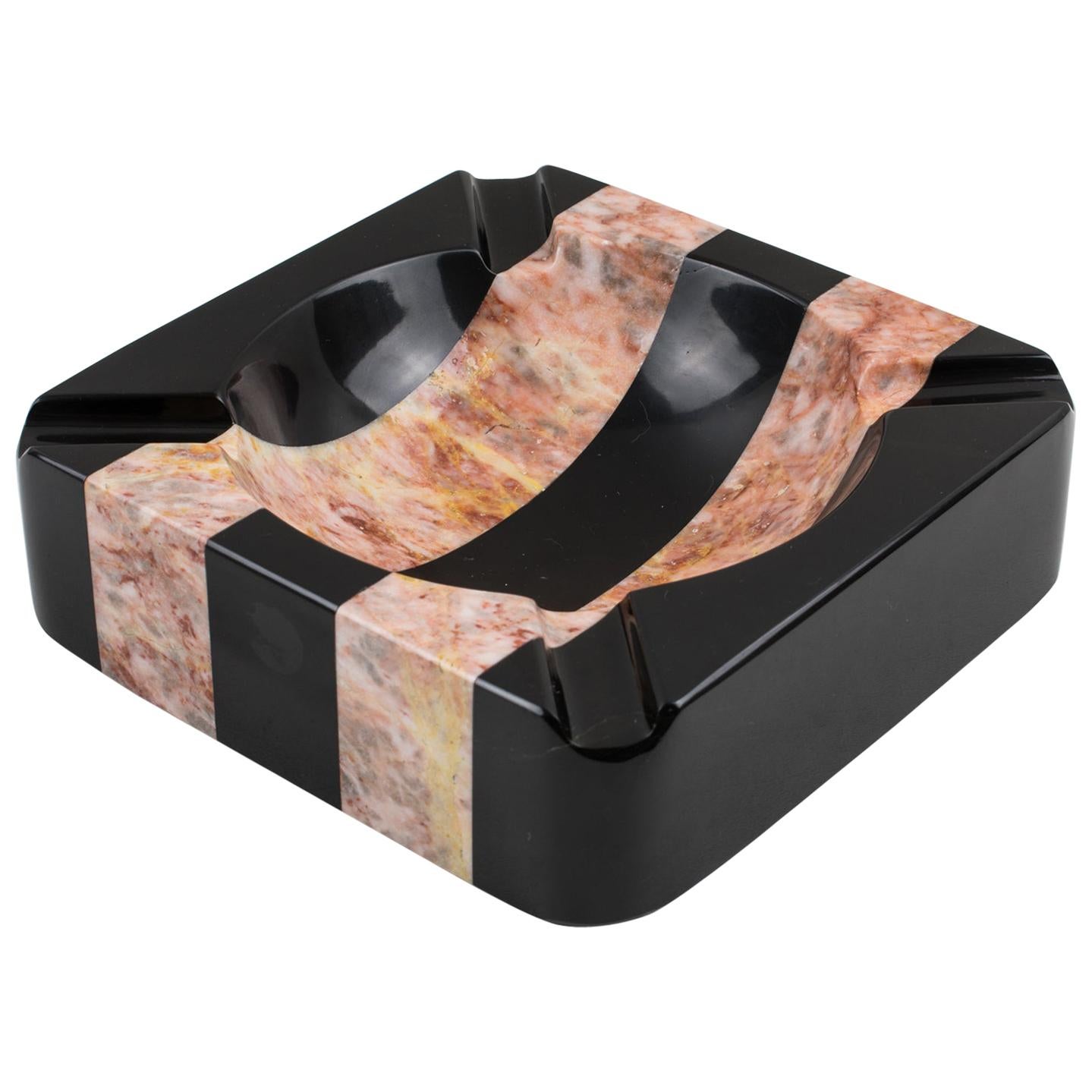 Spectacular large 1970s Italian modernist marble cigar ashtray, desk tidy, vide poche, or catchall. Extra thick marble slab with a striped pattern, and black and pink color stone. No visible maker's mark.
Measurements: 7.88 in. wide (20 cm) x 7.88