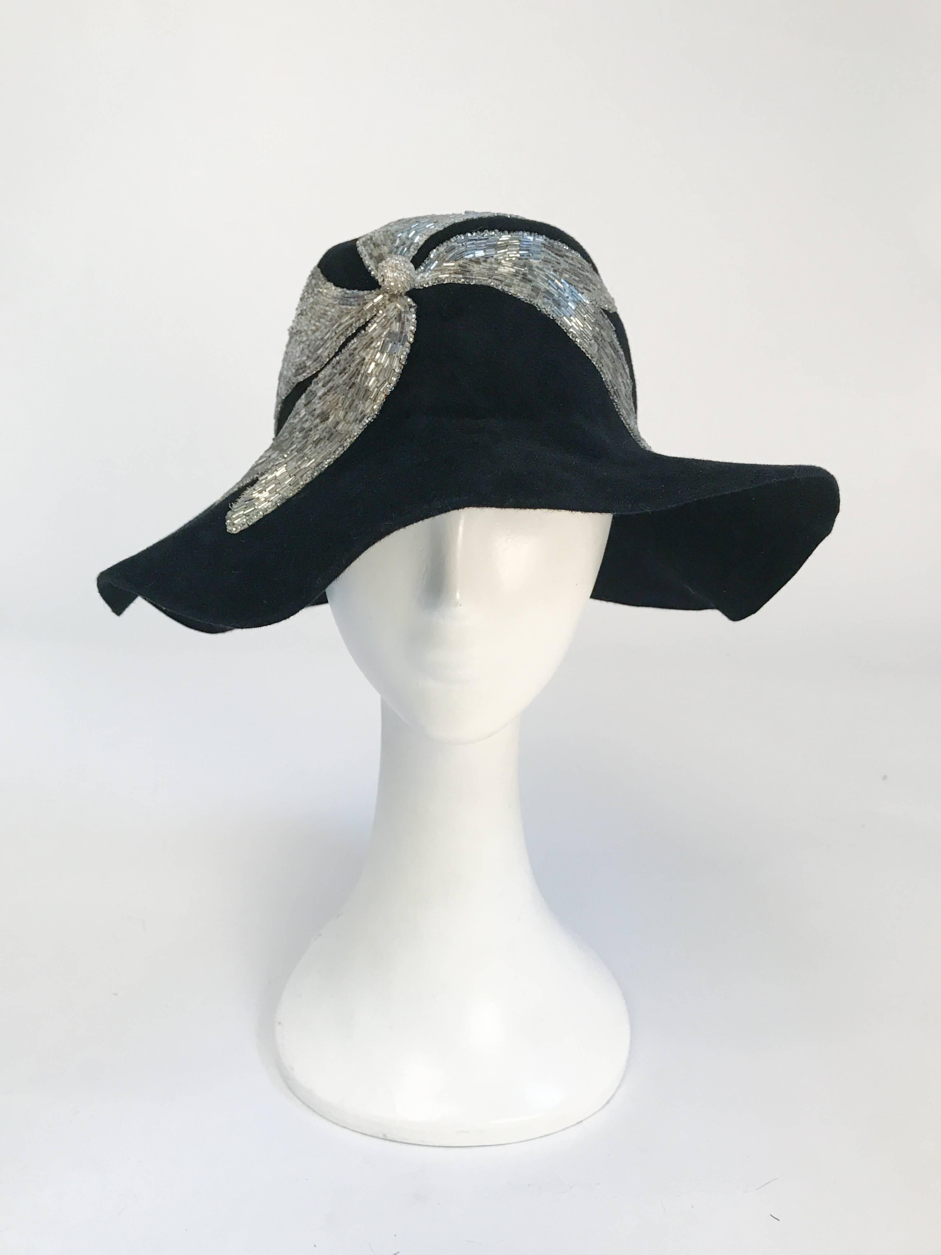 1970's Black and Silver Appliqué. Black fur felt wide brimmed hat with silver glass beaded applique. 21 1/2 inch circumference.