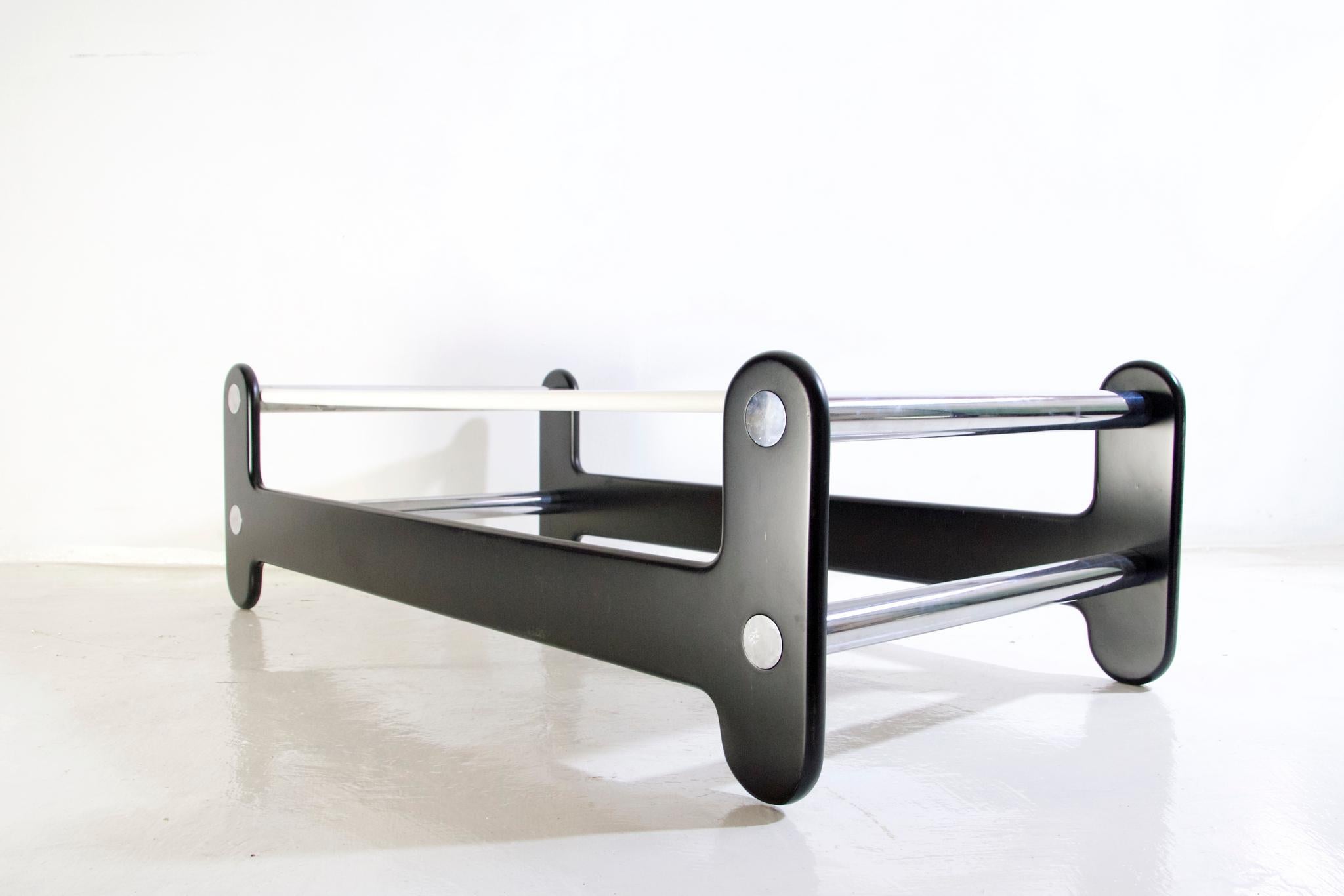 1970's rectangular black and white coffee table with chrome details in so called OP style representative of the era. The materials used are lacquered wood and chrome.