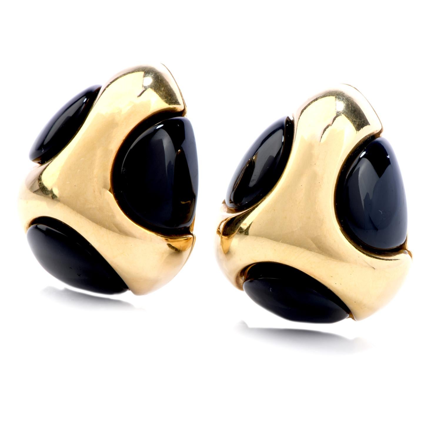 Wear this chic and fashionable Vintage 1970s Black Jade  18K Gold Polka Dot Tear Drop Clip Earrings the next time you venture into the city! 

These earrings are crafted in quality 18-karat yellow gold.  There are six genuine black Jade circle