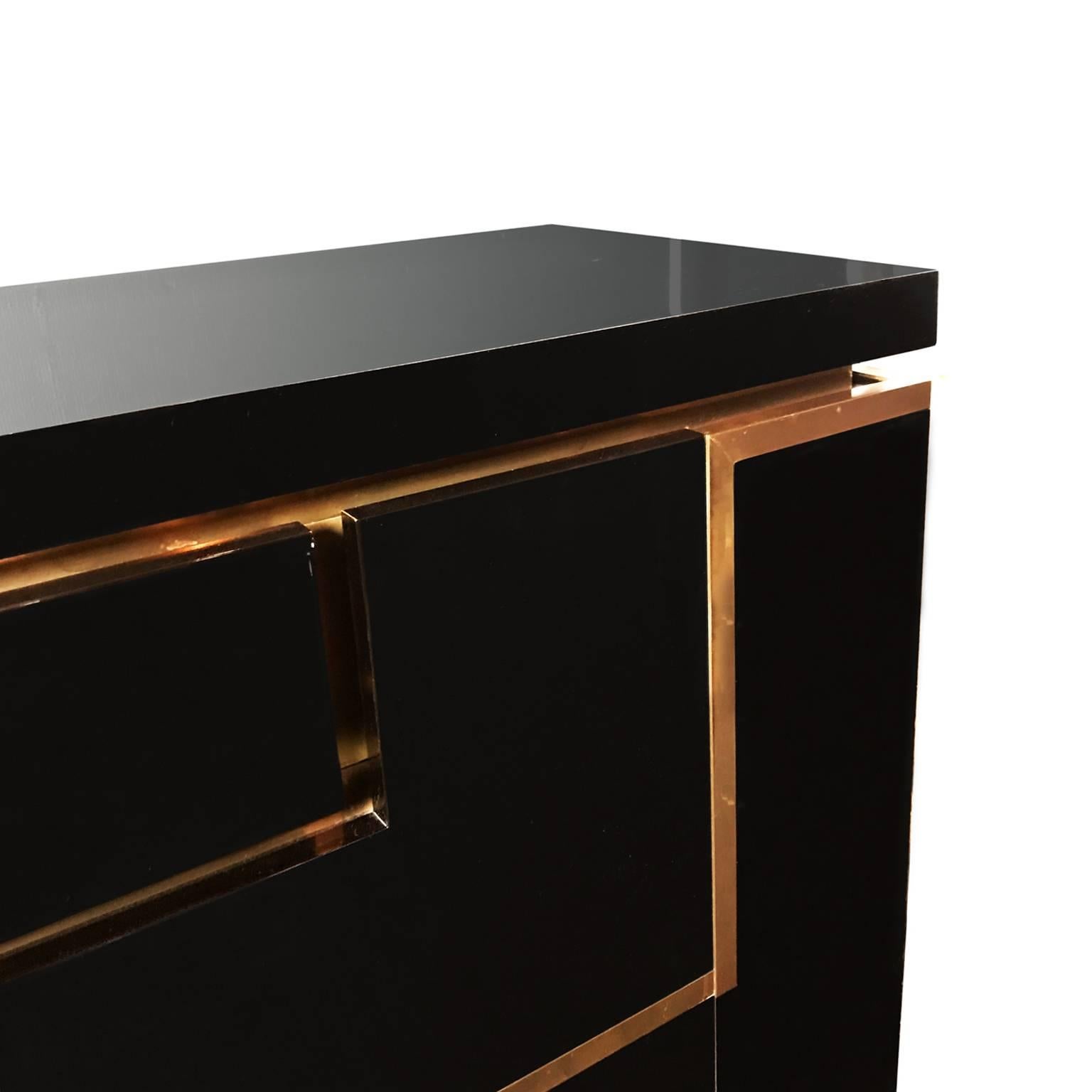 Black lacquer and brass sideboard by Jean Claude Mahey, French, 1970s.
