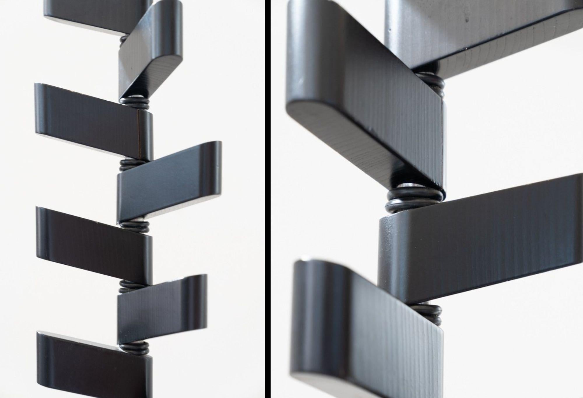 1970s Black Lacquered Coat Rack - Sleek Minimalist Design

Add a touch of vintage sophistication to your entryway or living space with this 1970s black lacquered coat rack. Designed with clean, minimalist lines and a timeless aesthetic, this piece