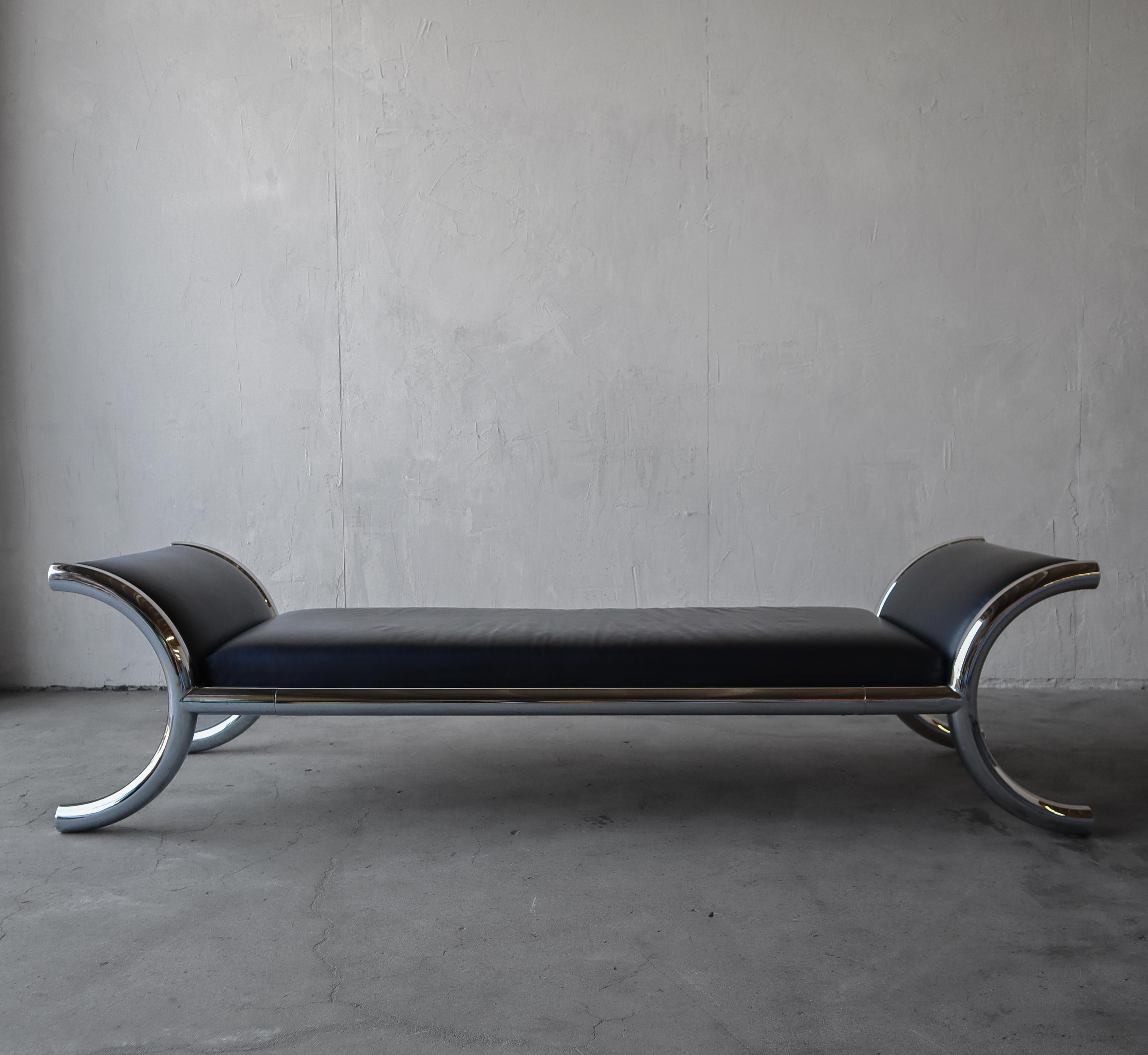 This oversized bench is more like a daybed, you can use it as either really. Would be beautiful on a focal wall with a massive piece of deserving art placed above. The seat is soft black leather and the frame is mirrored chrome, polished
