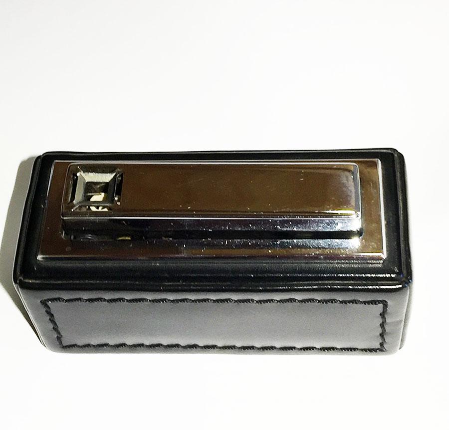 1970s black leather stitched Kawee, Karl Wieden Germany table lighter

This black leather stitched table lighter, manufactured by the Karl Wieden Company, 1970 Solingen, Germany

The cassette which can be filled with lighter gas is removable and