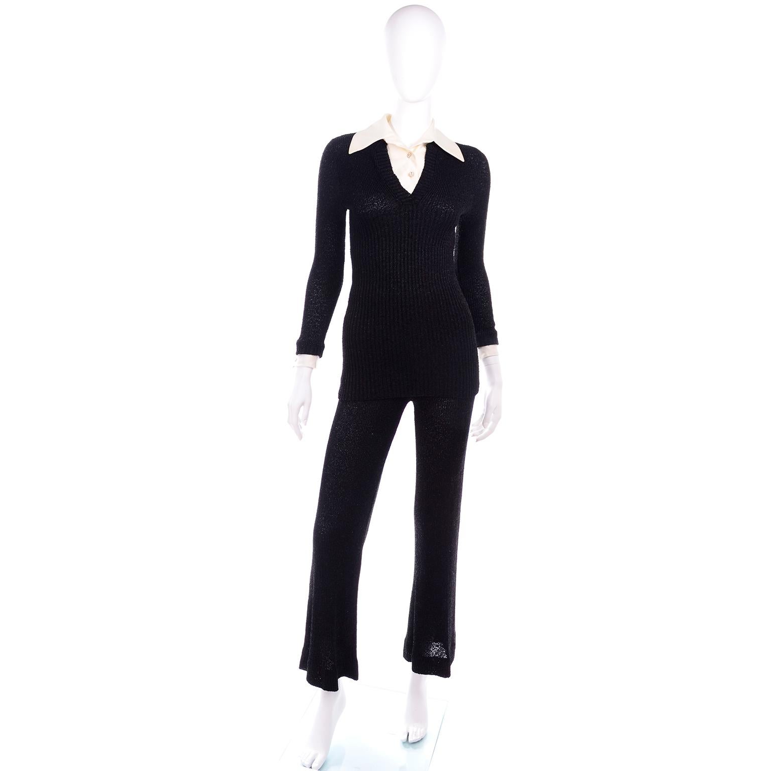 This is a gorgeous holiday evening ensemble! It is vintage from the 1970's and includes a black shimmering metallic knit outfit includes a pair of flared pants, a long sleeve sweater top and a detachable dickie with rhinestone embellished buttons.