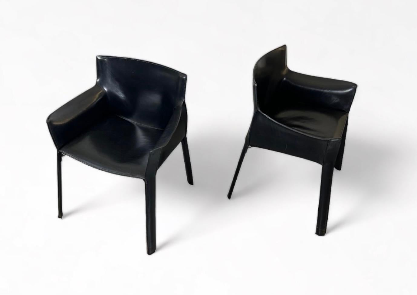 Mid Century Modern Giancarlo Vegni designed pair of P-90 arm chairs, black saddle leather over metal frame, for Fasem, Italy, 1970s. A contemporary of Mario Bellini's CAB 413 armchairs for Cassina.

These armchairs are constructed of the highest