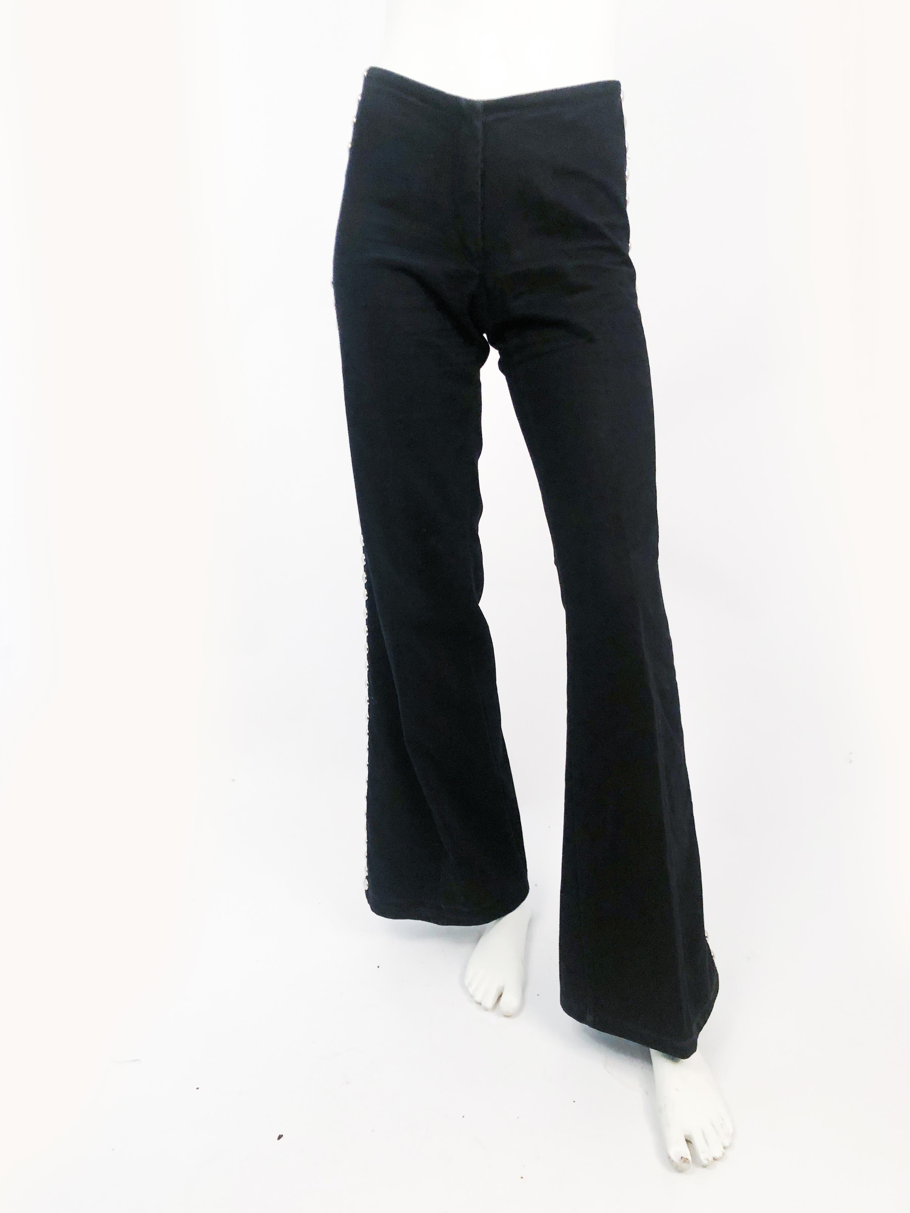 1970s Black Studded Bell-bottom Pants. Large round studs that go down the side of the pant leg and the back at the waistline.