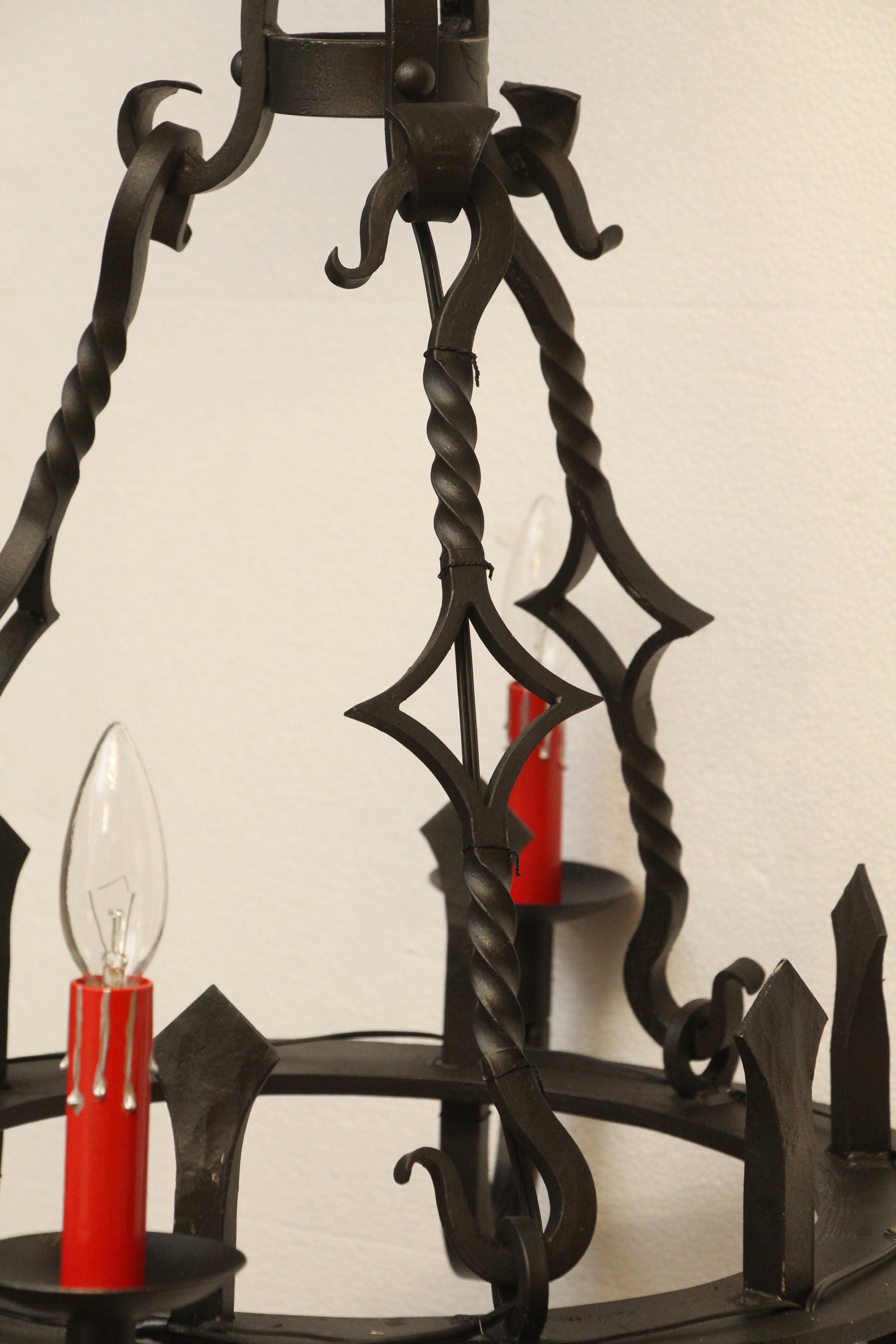 1970s Black Wrought Iron Gothic Chandelier 6 Red Candlesticks In Good Condition For Sale In New York, NY