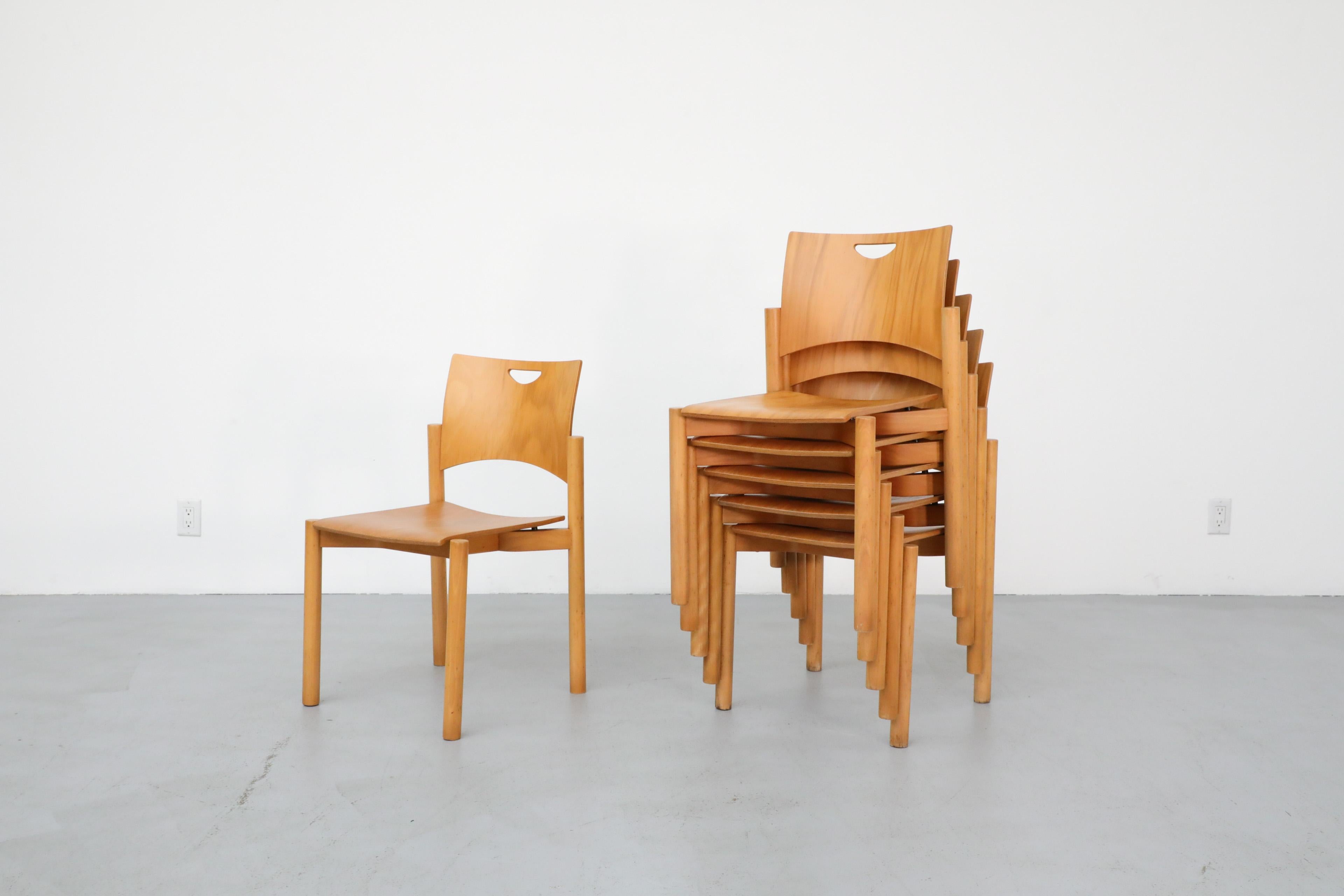 1970's Blonde Plywood Stacking Dining Chairs with Cut Out Handles by Casala In Good Condition In Los Angeles, CA
