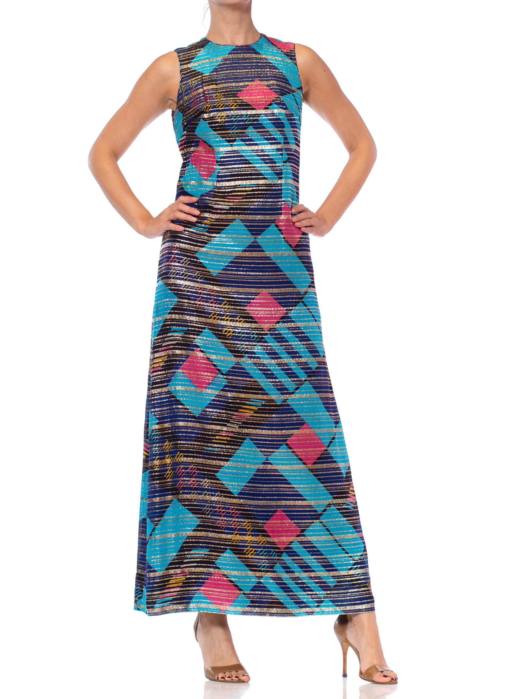 Custom hand made with beautiful demi couture details such as hand set zipper, piped neckline and hand finished hem. Fully lined in silky rayon 1970S Blue Silk & Lurex Lamé Pink Modernist Geometric Print Gown 