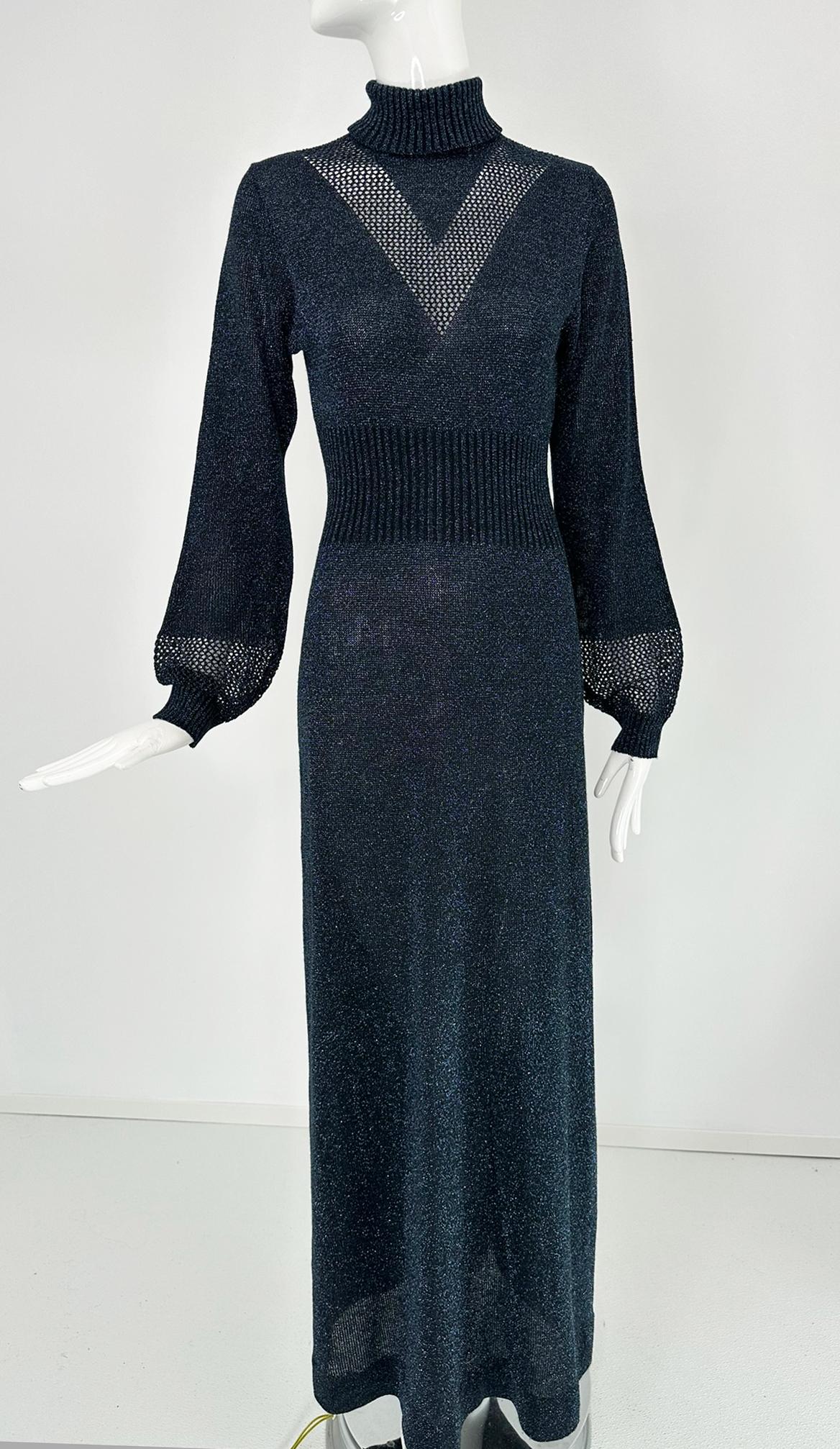 1970s dark blue & silver metallic knit, long, draped  cage cuff, sleeves maxi dress. Ribbed turtle neck with a fitted bodice and an open work V design at the front. Wide ribbed waist, dress skims the hip and falls in an A line to the hem. Closes at