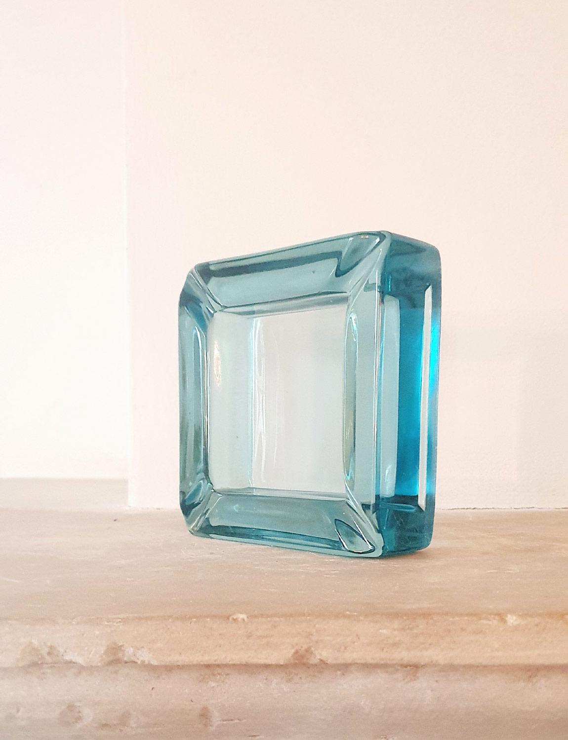 A thick hand blown Italian glass bowl or ashtray in pale blue. Made in the 1970s and found in Florence. 