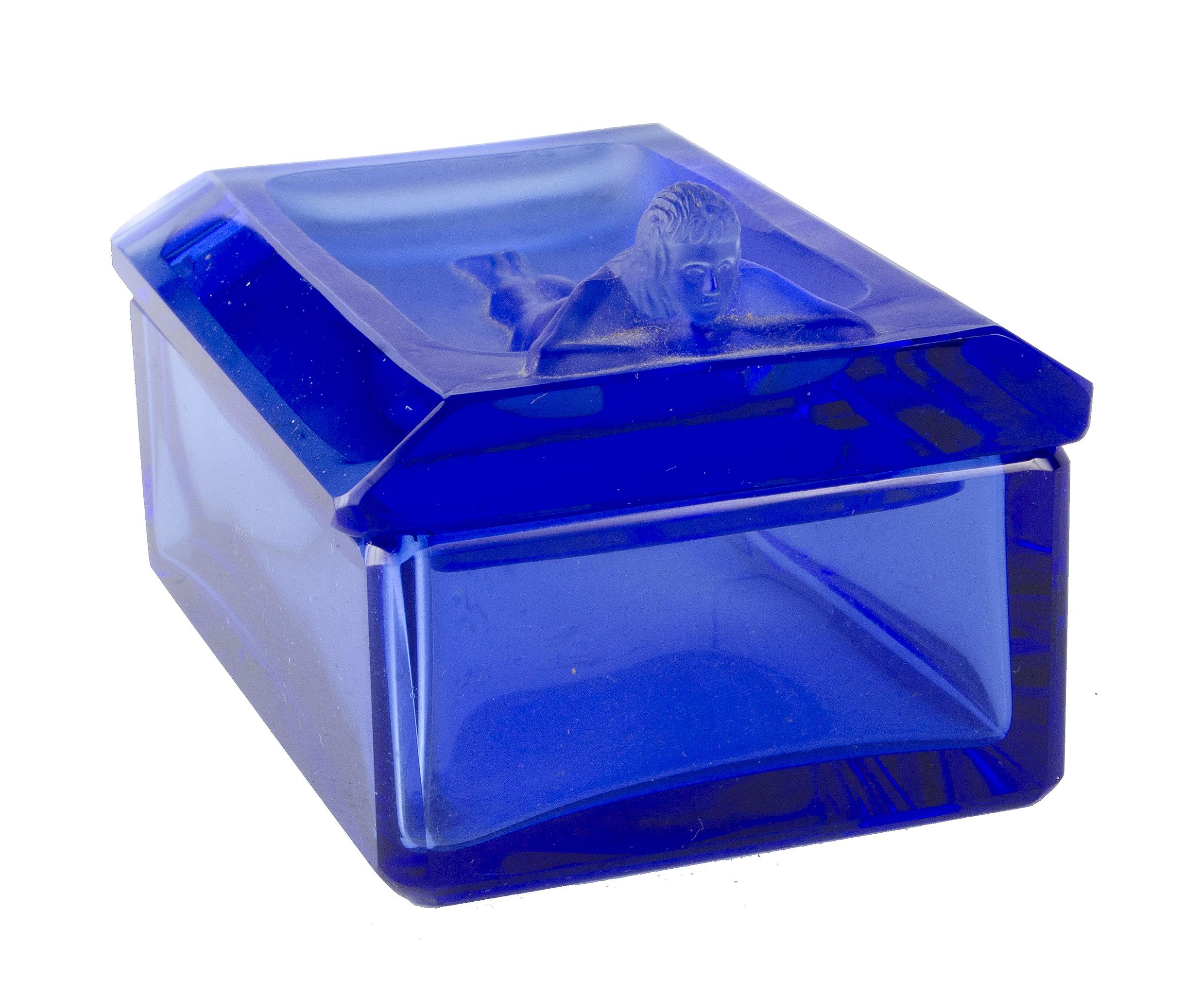1970s Bohemian translucent blue glass decorative box with a Nymph on the lid, Czech Republic

By: unknown
Material: glass, crystal
Technique: cast, pressed, polished
Dimensions: 3.75 in x 2.5 in x 2.25 in
Date: mid-20th century, circa 1970
Style: