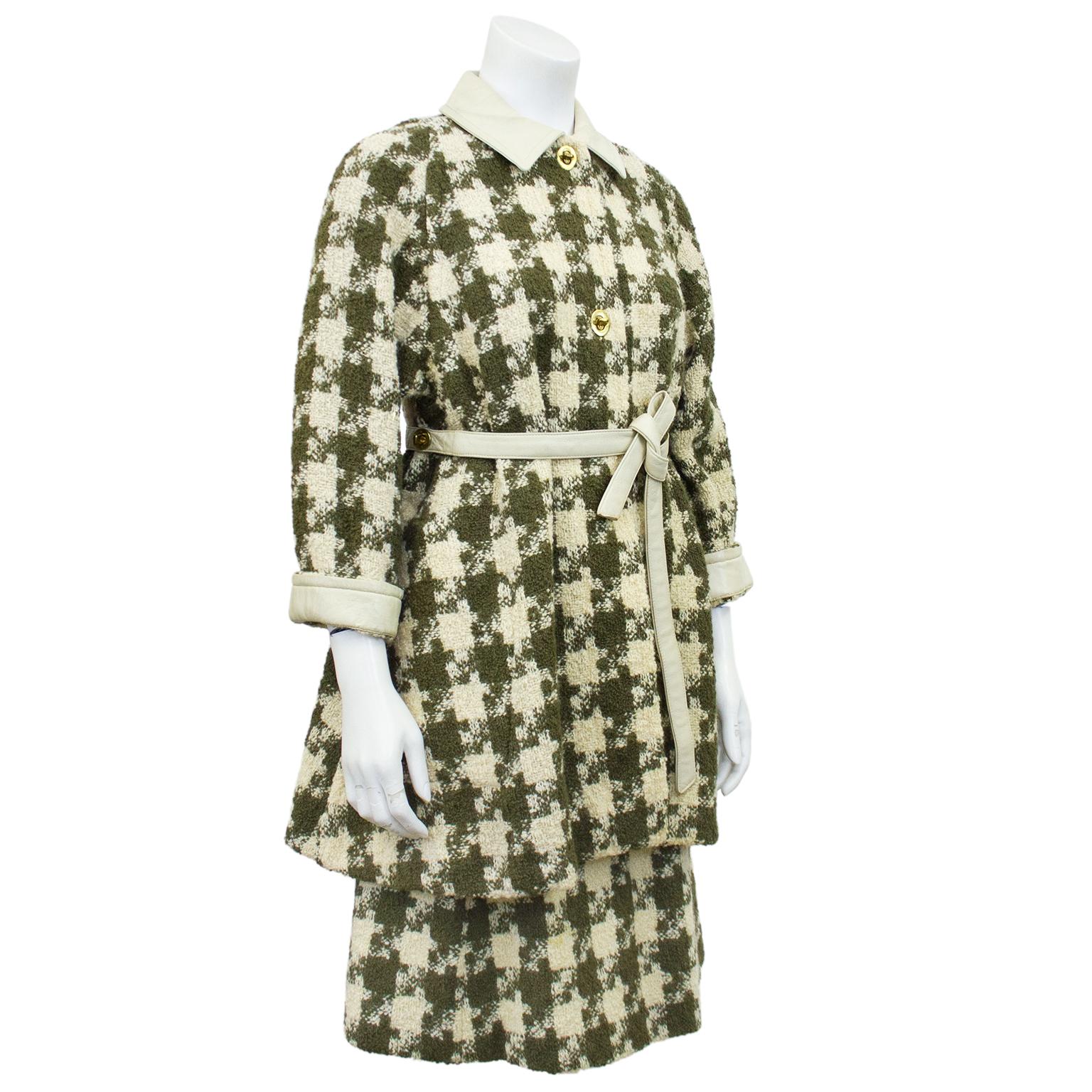 Darling Bonnie Cashin coat and skirt wool ensemble from the 1970s featuring an oversized cream and sage green allover houndstooth pattern. Cream leather collars, cuffs, belt and trim, and gold tone twist button closures. Jacket is long sleeve, but