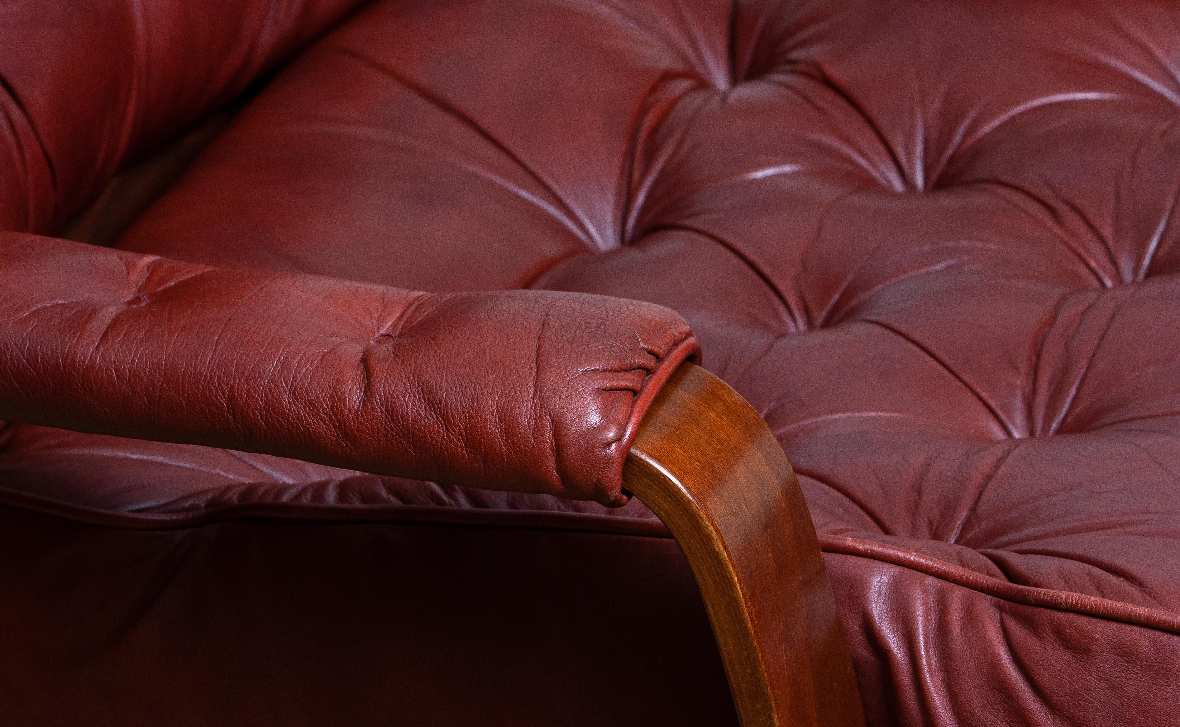 Late 20th Century 1970s, Bordeaux / Brown Rocking Swivel Lounge / Easy Chair and Ottoman by Kropp