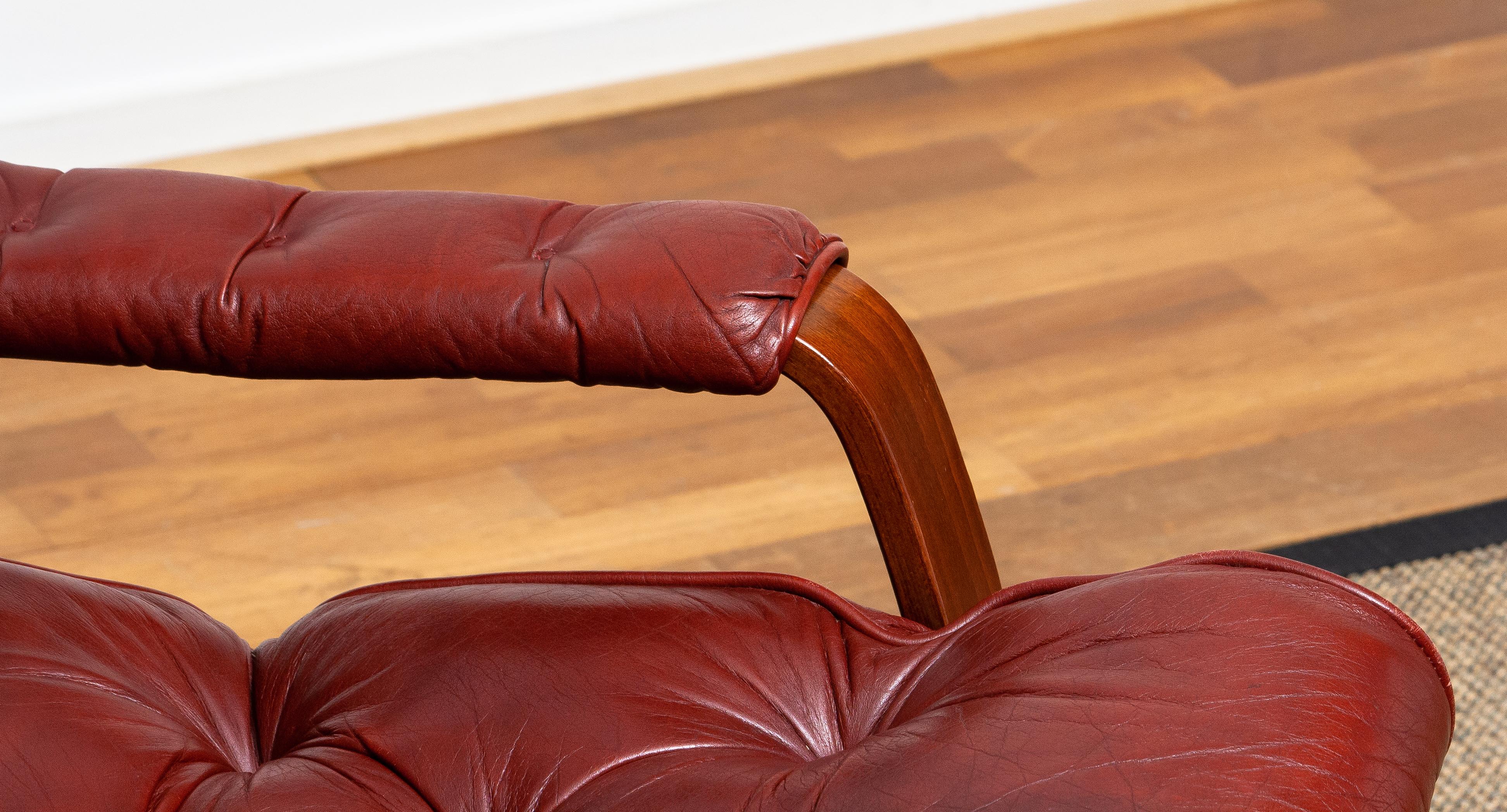 Leather 1970s, Bordeaux / Brown Rocking Swivel Lounge / Easy Chair and Ottoman by Kropp