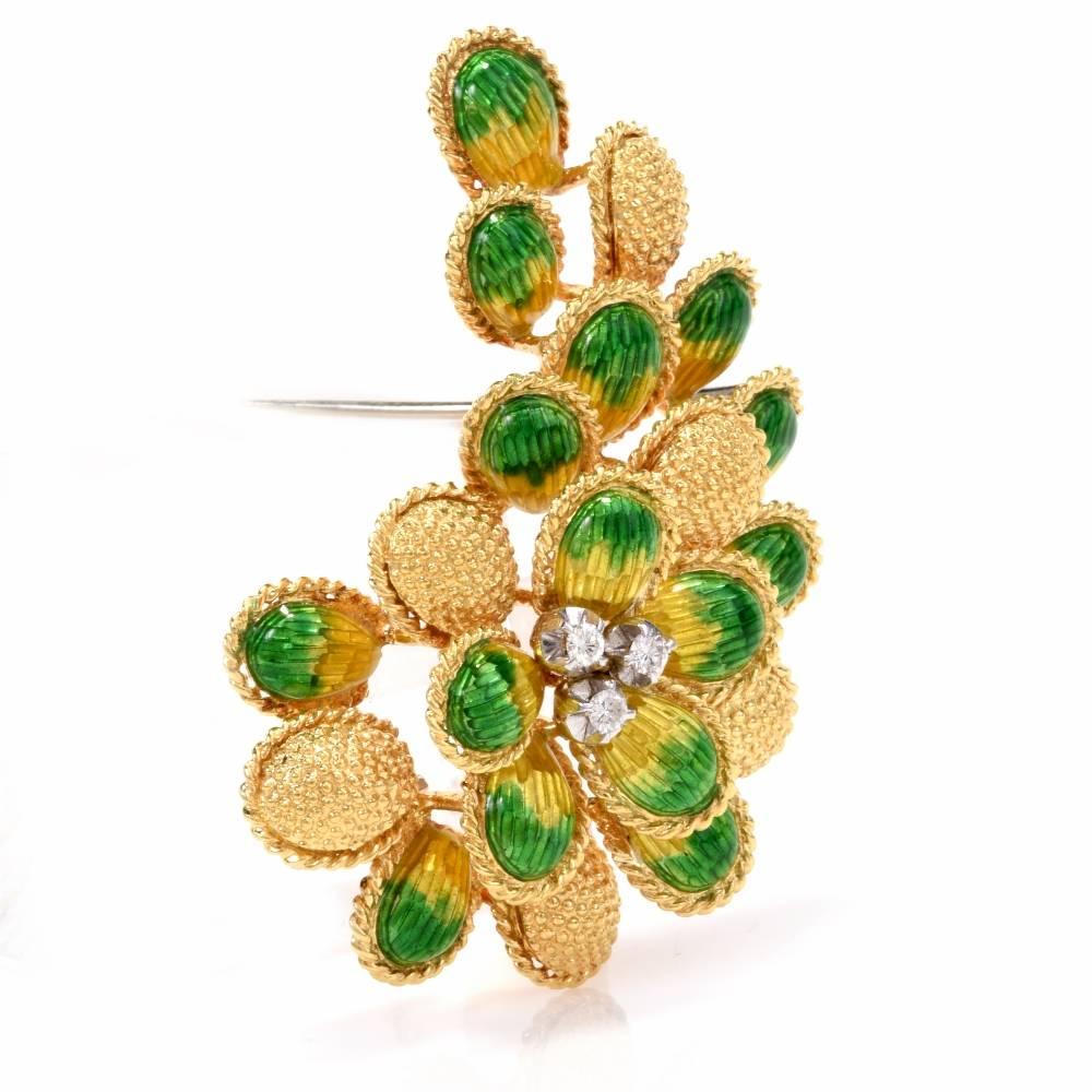 This botanically inspired  vintage brooch of enchanting aesthetic simulates a bunch of grapes, rendered in 18 Karat finely granulated and matted yellow gold. The brooch consists of yellow gold and enameled elements, all surrounded by twisted-rope