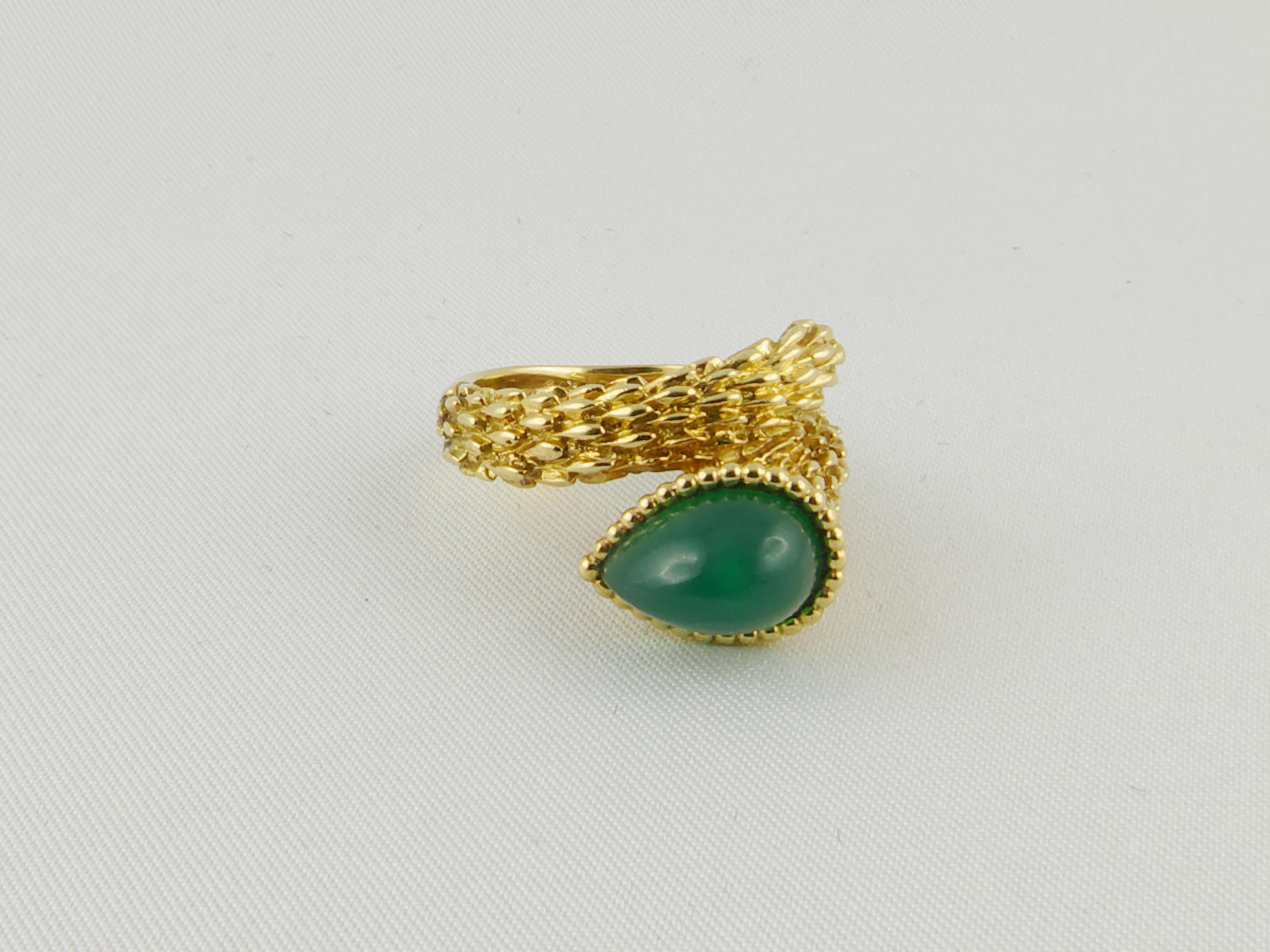 Fine and feminine, this Serpent Bohème ring is set in 18 karat  textured Yellow Gold  with a Chrysophrase pear-shaped cabochon crowned with gold beads. Finely crafted in 1970s by French jeweler Boucheron. The shank's Gold engravings have been raised
