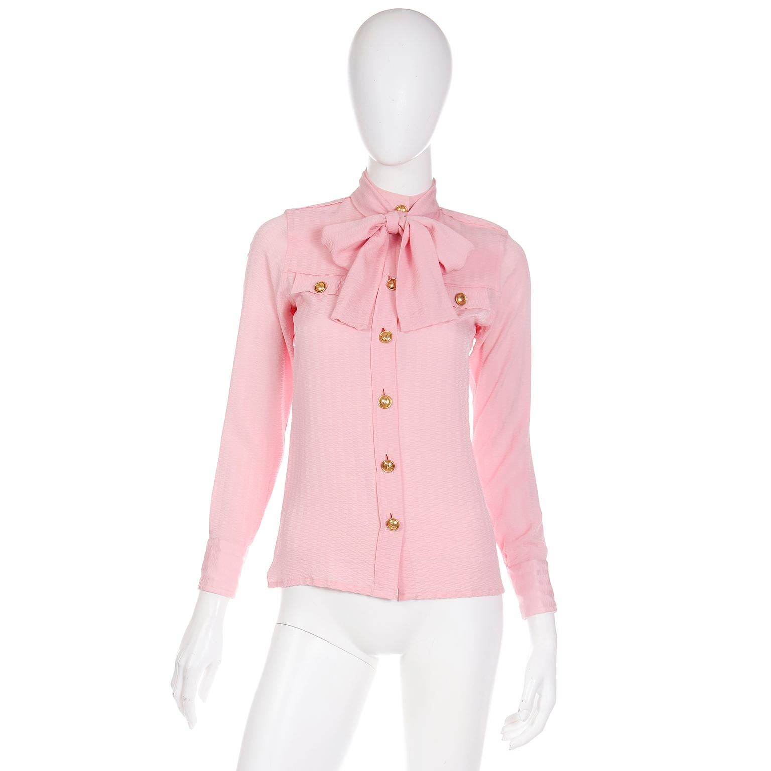 This is an exceptional tonal patterned pink silk vintage blouse from Boutique Valentino. This rare 1970's Valentino pussy bow blouse is truly a a garment that will elevate anything you pair with it. You can wear this top with the pretty sash tied in