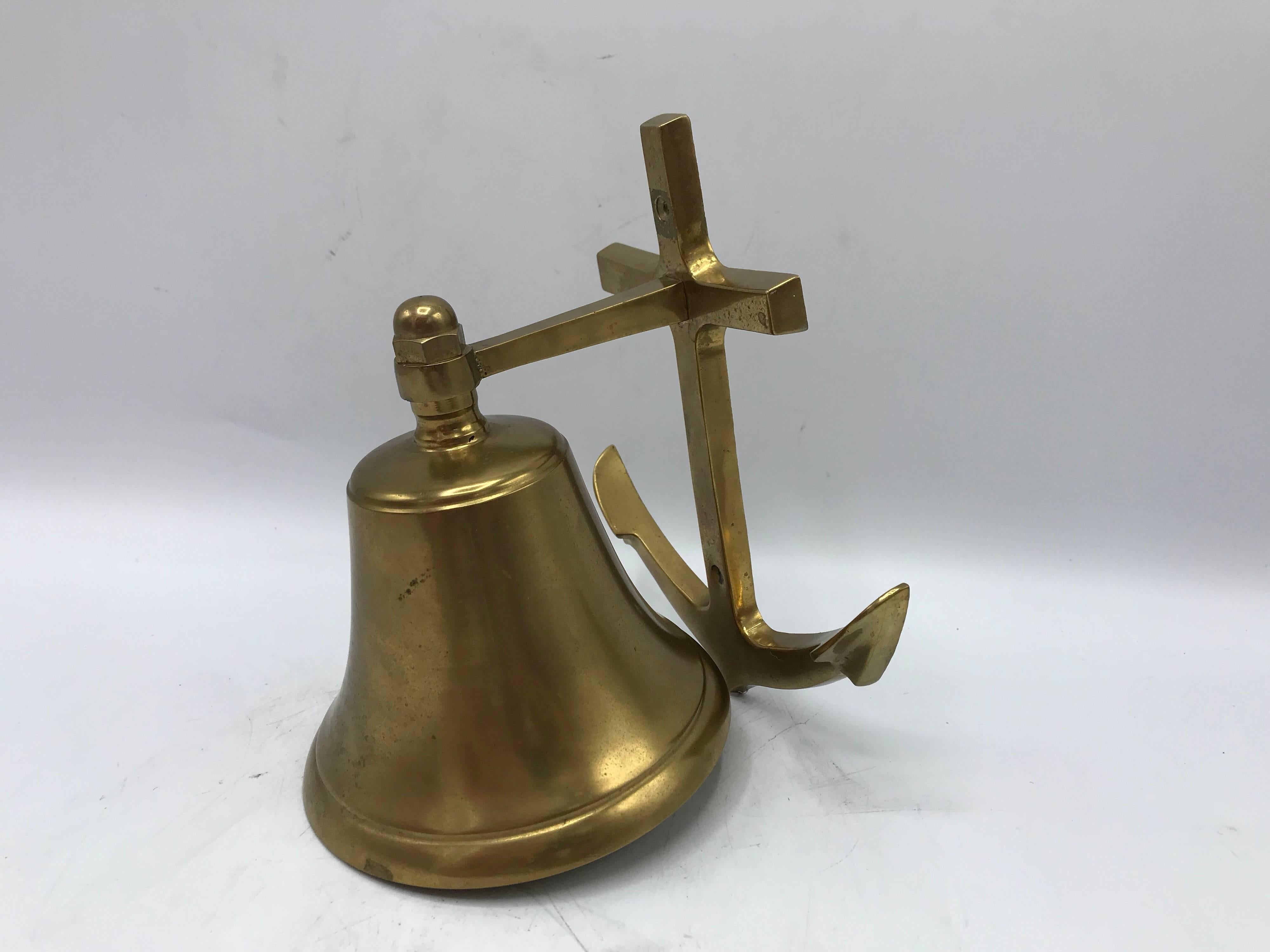 Listed is a fabulous, 1970s solid-brass door knocker bell in the shape of an anchor. Heavy.