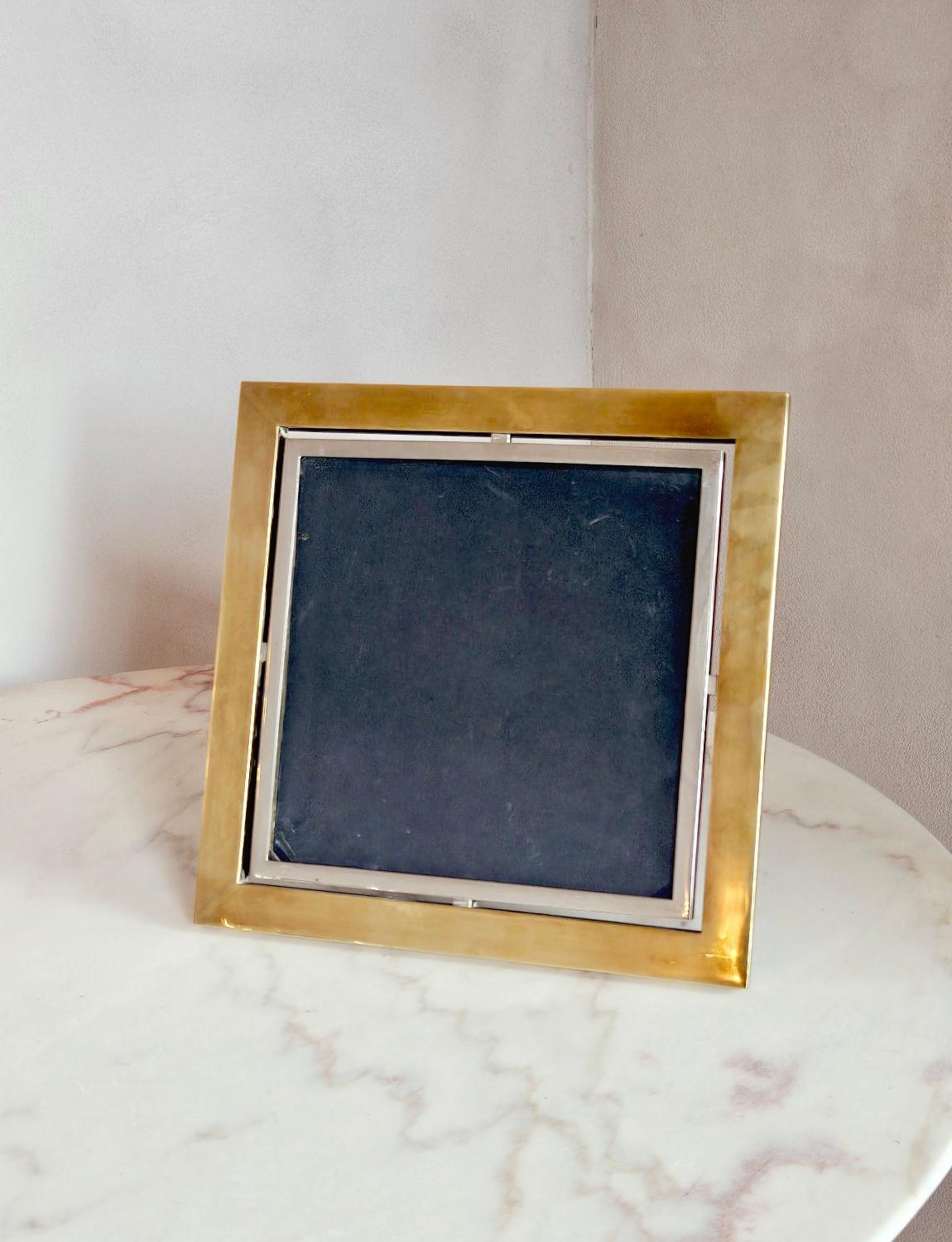 A wonderful large, square Tomasso Barbi photo frame made in Italy in the 1970s. The frame has a chrome internal rim attached to a stunning brass frame.