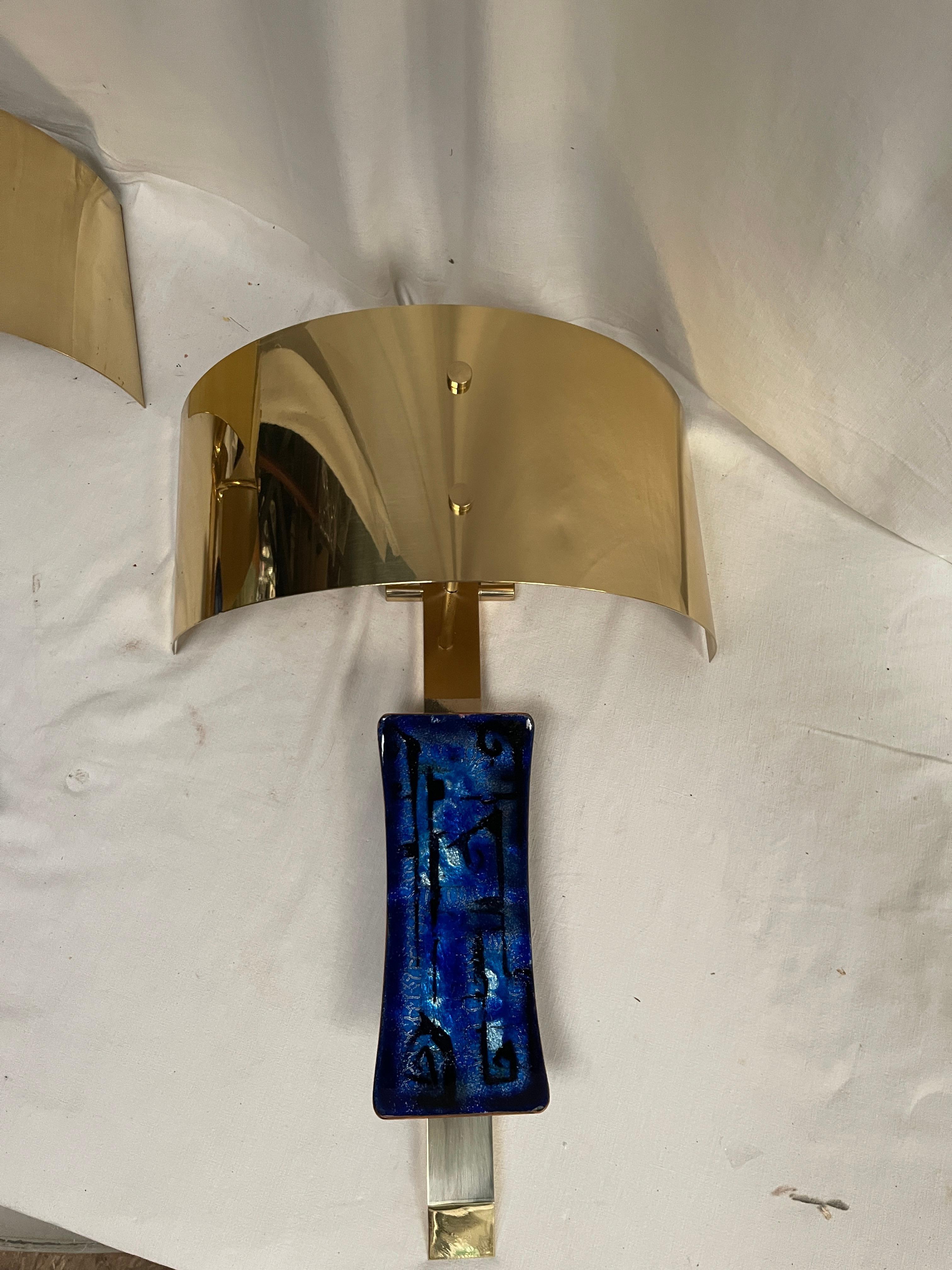 Rare and unusual pair of sconces  with enamel decorative piece
All refinished and re-wired
Possibility of a second pair
