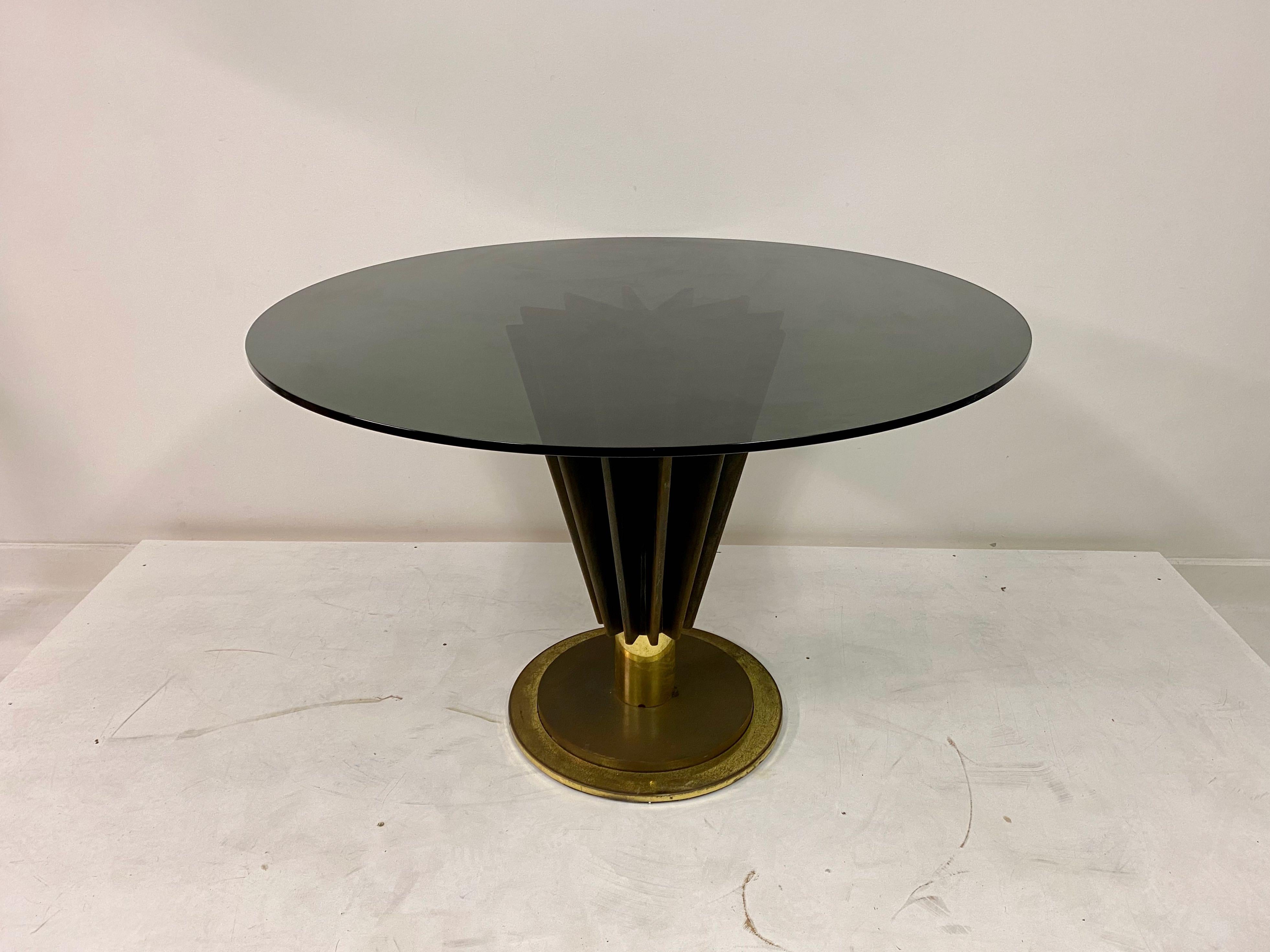 Dining table

By Pierre Cardin

One pedestal

Round smoked glass top

Iron and brass base

Signed

1970s, Italian

Glass can be changed to clear if preferred

Brass can be polished if desired.