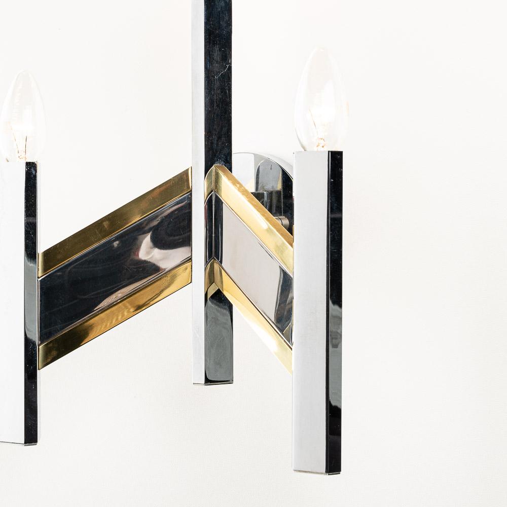 Classic Gaetano Sciolari style Sconce with characteristic use of chrome and brass. It holds three E14 lightbulbs.

Please note, we have more chandeliers and scones in the same style in store. Please do not hesitate to contact us if you are