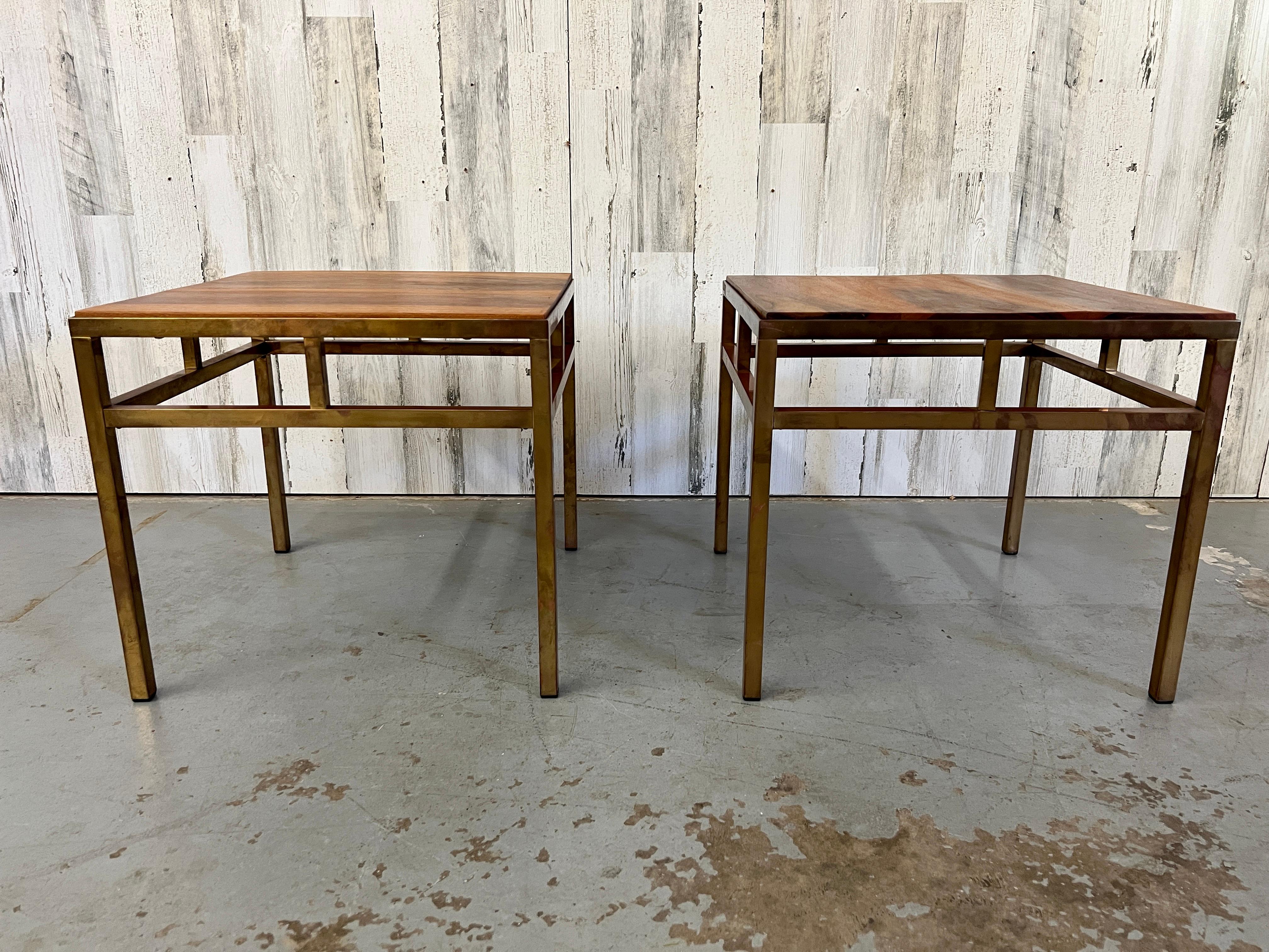 Pair of solid brass angular side tables with solid golden walnut tops.